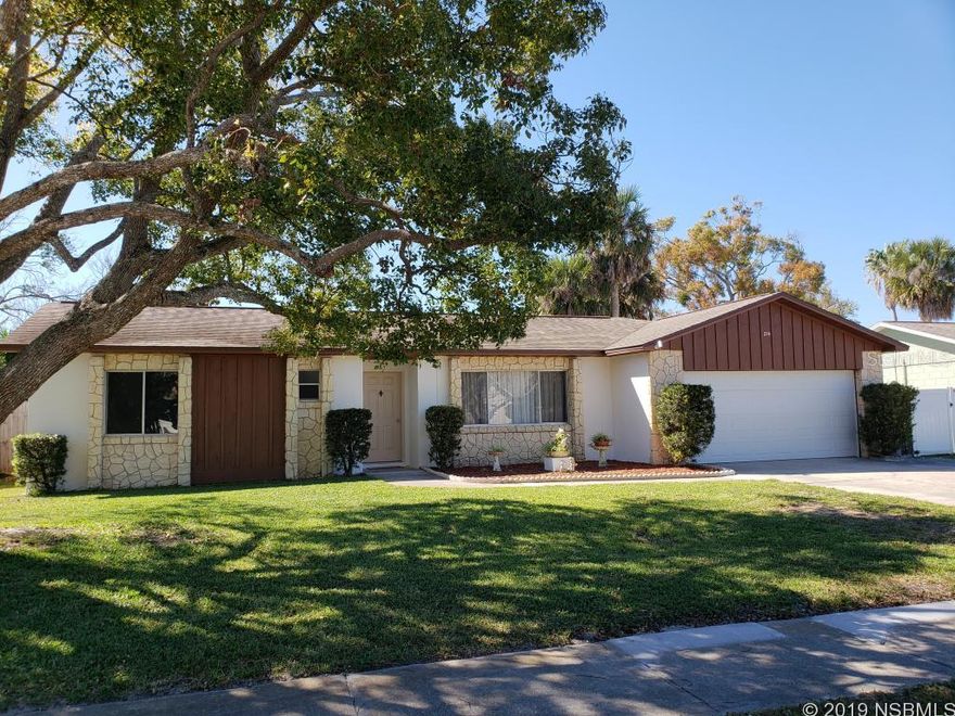 Make your way to this amazing move-in ready value in the heart of Port Orange! The large picture window in the spacious living room lets in tons of light. The kitchen has been updated to include granite counters and lovely oak cabinets, and is open to the dining area for easy entertaining. The large master features a walk in closet and the en suite has been beautifully updated. Split plan, generously sized bedrooms and tile throughout ensures comfort and easy cleaning, and the 2nd bath is updated as well. Screened patio with a 2nd concrete pad and concrete walkway and a huge fenced back yard with fruit trees - plenty of room for a pool! Freshly painted in neutral tones so you can add your own personality to this lovingly maintained home! Reclaimed water sprinklers in front. ;Water: City