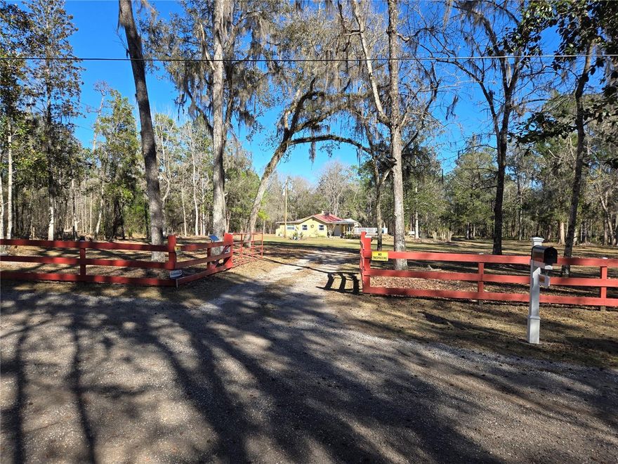 Seize this unique opportunity to own a homestead with the perfect blend of privacy, natural beauty, convenience and the ability to be self-sustaining, with this move in ready, super comfortable 2BR/1BA single family home on 4.80 acres at the end of a quiet, paved road in Brooksville, Florida. Enjoy exceptional seclusion with two sides of the property — to the north and east — bordering a vast conservation area (Chinsegut) filled with trails to explore.  Property is zoned AR, allowing for livestock as well.
This 1,246 sq ft home has been thoughtfully updated throughout, including a brand-new home foundation and brand-new subfloor, both completed by licensed professionals and backed by transferable warranties. Inside, new laminate flooring and deluxe baseboards create a clean, modern finish that pairs beautifully with the fully renovated bathroom, electrical updates, and the cozy wood burning fireplace with a stone mantel, hearth and chimney.
Outdoor living shines here with a new 36' x 28' composite deck featuring a built in 8.5' x 12.5' spa with secure railing — perfect for entertaining or unwinding under the stars. A 12' x 24' shed with electricity and water offers ideal space for storage, hobbies, or workshop use. The property is fully fenced with motion sensor and solar lighting throughout.
The 4.80 acres are mostly cleared and dotted with oak, pine, and cedar trees, along with an impressive variety of fruit trees including orange, fig, papaya, peach, persimmon, olive, Meyer lemon, guava, cherry, and yucca. Wildlife sightings are common, adding to the peaceful, natural setting.
The sale includes all kitchen appliances, featuring a brand-new large side by side refrigerator, plus a washer, dryer, and water softener. Additional recent upgrades include a 2021 tin roof, new gutters, four mini split AC units (installed 2021) with room to add another unit, a one-year-old well, and a septic system inspected in the last three (3) months. A new automatic entrance gate opener has also been added.
Seller is open to negotiating the purchase of lawn/property equipment, if desired. Located less than six miles from major conveniences, this property offers a rare opportunity to enjoy peaceful country living while staying just minutes from everyday essentials.
Additional video and photos coming soon!  Come see this gem before it is gone!!