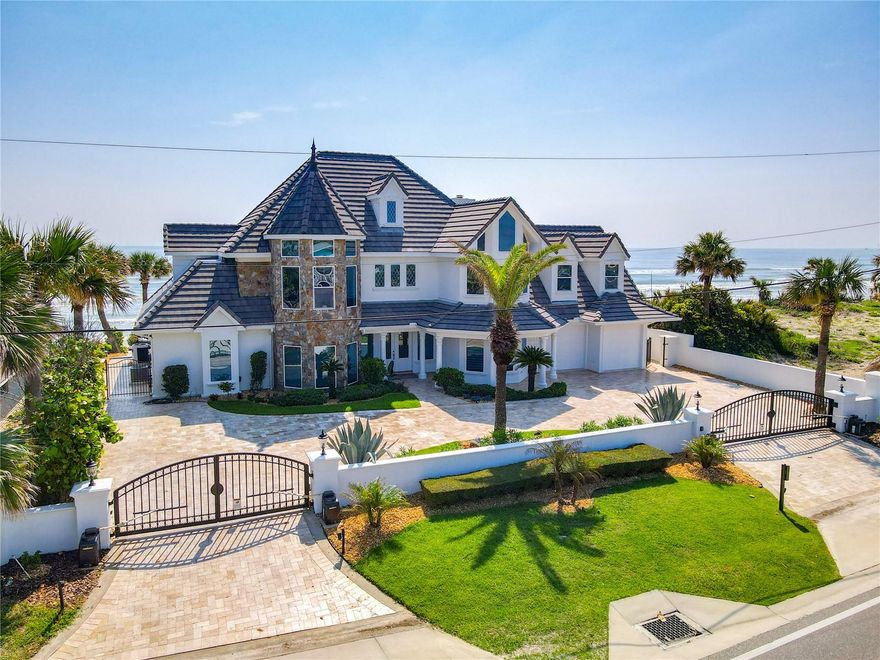 Exquisite Architecture, breath-taking ocean views, expansive home, gated and fully renovated on one of the highest beachfront lots in the area. Boasting just over 5300 sq feet of living space, 100 ocean feet of frontage, castle-like living right on the water. New commercial grade gate entry system to keep property private. When entering this home you are welcomed immediately with beautiful marble flooring throughout the downstairs of the property, an amazing hardwood staircase with custom tiling and wonderful ocean views to be seen throughout. This smart home features a full indoor and outdoor sound system, fully automated lights, security system, Nest thermostats and cameras that can be accessed through your smartphone. There are 6 bedrooms and 5.5 bathrooms, attached in-law suite, and an open layout throughout the property that allows every person to enjoy the space, views and comfort the property has to offer. This property has a stunning open concept kitchen and dining room area that makes entertaining a dream. Top of the line gaggenau appliances all throughout. Custom high end fits and finishes all over the entire property. Massive master bedroom upstairs with incredible unobstructed 180 degree views of the ocean. Big luxurious walk-in closet and master bathroom with dual sinks, walk-in shower and soak in tub allowing you to relax after a long day by the water. There is an additional full bathroom and bedroom upstairs. There are two additional bedrooms downstairs, each having their own full bathroom attached. Private and quiet office area also awaits you. Attached in-law suite that allows extra privacy. Gorgeous and large back deck, Pool, Spa and outdoor shower that allows ultimate relaxation, views and privacy with no drive-in beach access. Contact today to schedule a tour of your dream home.