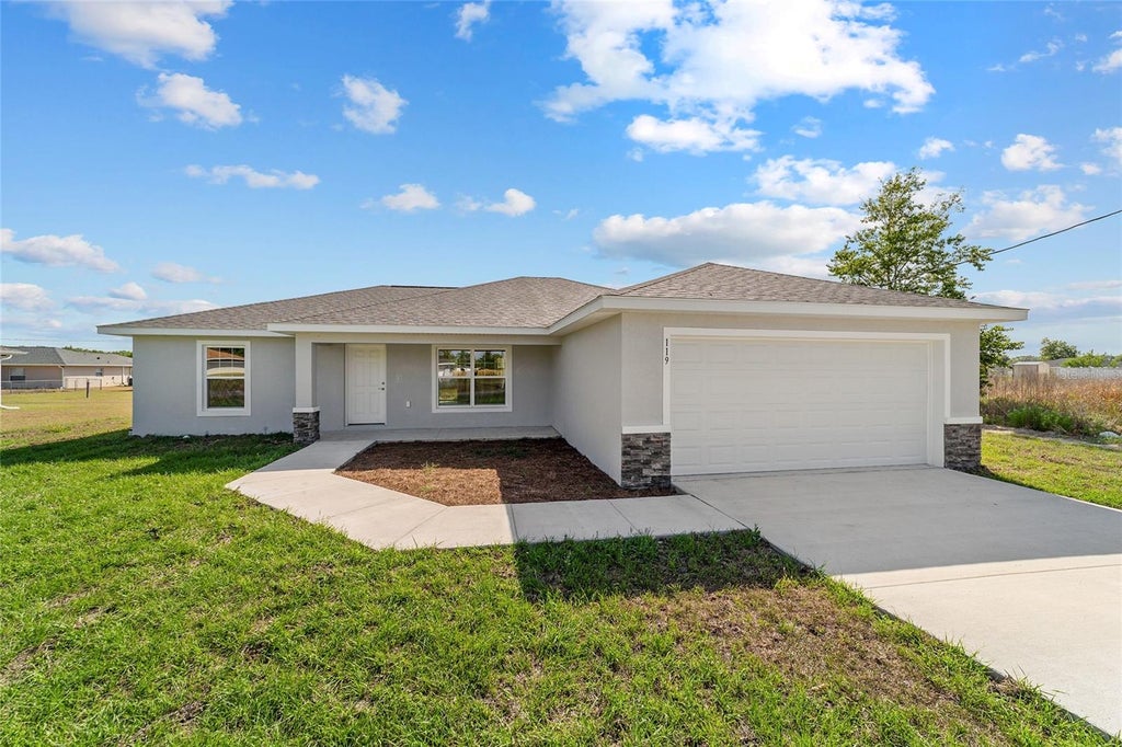 Photo of 349 Malauka Loop, Ocklawaha, FL 32179 (MLS # OM732908)