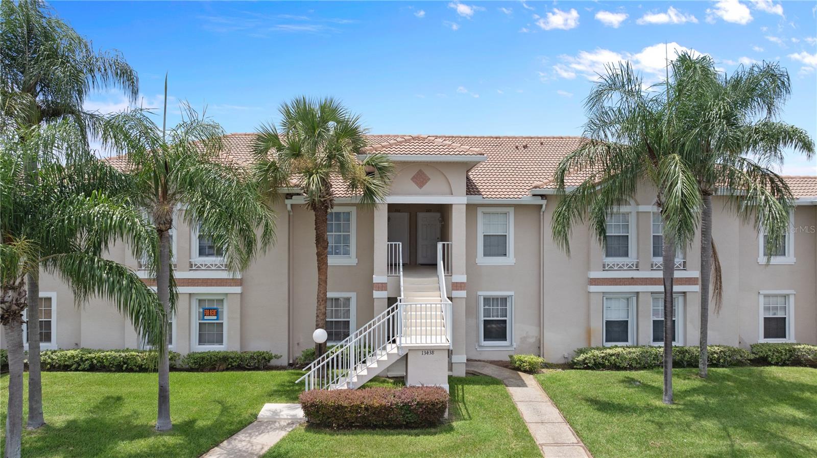 Welcome to this beautifully updated 3-bedroom, 2-bathroom condo offering serene pond views and a bright, open layout. This second-floor unit features high ceilings, elegant tile flooring throughout the main living areas, and modern finishes for comfortable living. The kitchen is equipped with stainless steel appliances, granite countertops, and ample cabinetry, with direct access to a private screened-in balcony overlooking the lush green space and tranquil water view. The spacious primary suite includes a walk-in closet and en-suite bathroom with dual vanities. Additional features include a full-size washer and dryer and laminate flooring in the bedrooms. Enjoy access to the community pool and beautifully maintained common areas. Conveniently located near major highways, the Orlando International Airport, Lake Nona Medical City, shopping, dining, and top-rated schools—this property offers the perfect combination of comfort and convenience.