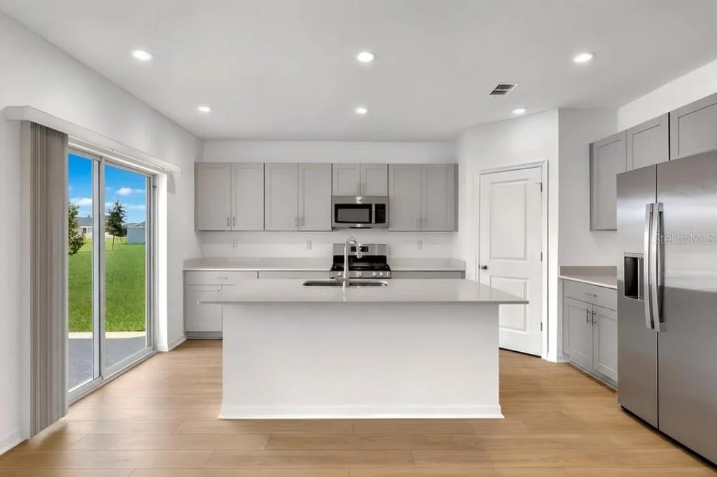 Photo of 5326 Loggia Lane, Kissimmee, FL 34758 (MLS # O6449302)