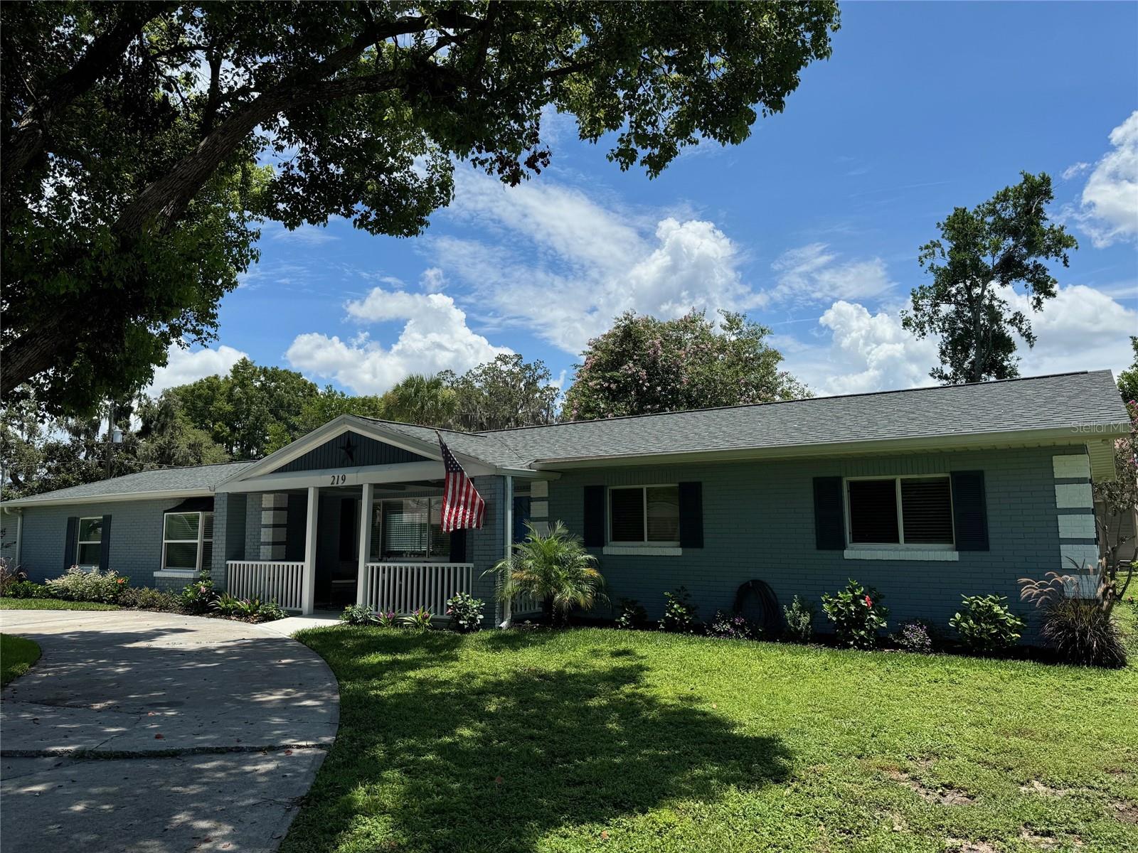 This Beautiful Home Remodel was Gutted from the Concrete Block Inward. All Studs, Wiring, Walls, A/C Ducts, Insulation, Ceilings, Floors, Cabinetry, Plumbing, Fixtures, Kitchen and Both Bathrooms are New and Permitted. Roof was Replaced in 2023. Property Includes Deeded Access via 25’ Lot to Lake Eustis on the Harris Chain of Lakes. Enter into Large Living Room, Open Concept Dining and Kitchen to the Left with Sliders Inviting you to Grill, Entertain, Recreate and Relax on Your 682 SqFt Pool Deck and Privacy Surrounded Pool. New Primary Bedroom has Fireplace, En Suite Bath and Walk-In Closet Offering Peaceful View and Access to the Pool. Two Additional Bedrooms with New Bath Between are to the Right with Plenty of Closet Space. Adjacent to the Kitchen is Inside Laundry Room Including Washer, Dryer and Storage. Two-Car Garage Rounds Out Your Lovingly Restored Home. World Renowned Harris Chain of Lakes Hosts Bass Tournaments, Sea Plane Fly-Ins, Antique Boat Shows, Boat Parades, Fireworks, Restaurants and many Festivals in the Lake Front Parks of Eustis, Mt Dora and Tavares, all within Five Miles. No Cookie Cutter here! Make Your Appointment Today to see this Florida Living Wrapped in a Custom Home on a Half Acre with Lake Eustis Across the Street!