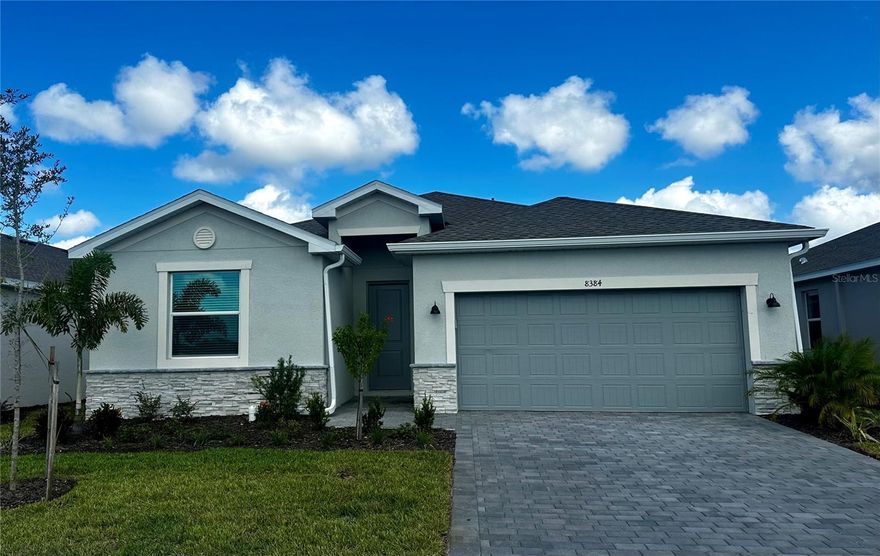 Live the Florida lifestyle in this beautifully designed single-story home at Island Lakes at Coco Bay—Englewood’s premier gated coastal community. This home offers tranquil lake views and peace of mind with impact windows and an X flood zone location (no flood insurance required). The open-concept layout is perfect for entertaining, featuring a bright kitchen with white shaker cabinetry and quartz counters, spacious dining area, and family room that flow to the covered lanai overlooking the water. Relax in the private owner’s suite with a spa-style bath and large walk-in closet. Enjoy resort-style amenities including a pool, clubhouse, pickleball courts, fitness center, playground, high-speed internet, and yard maintenance—all included with the HOA. 4 bedrooms, 3 baths, and a 2-car garage complete this picture-perfect Florida retreat.