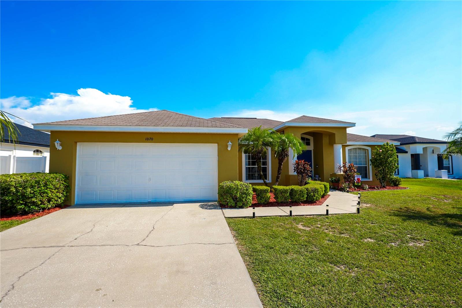 Spacious 4-bedroom, 2-bath home with beautiful lake views! Freshly painted outside, this home offers an open layout perfect for family living or entertaining. A brand-new roof will be installed prior to closing for added peace of mind. Enjoy relaxing evenings on the back patio overlooking the tranquil lake. Don't miss this move-in ready home with great curb appeal and a serene setting!