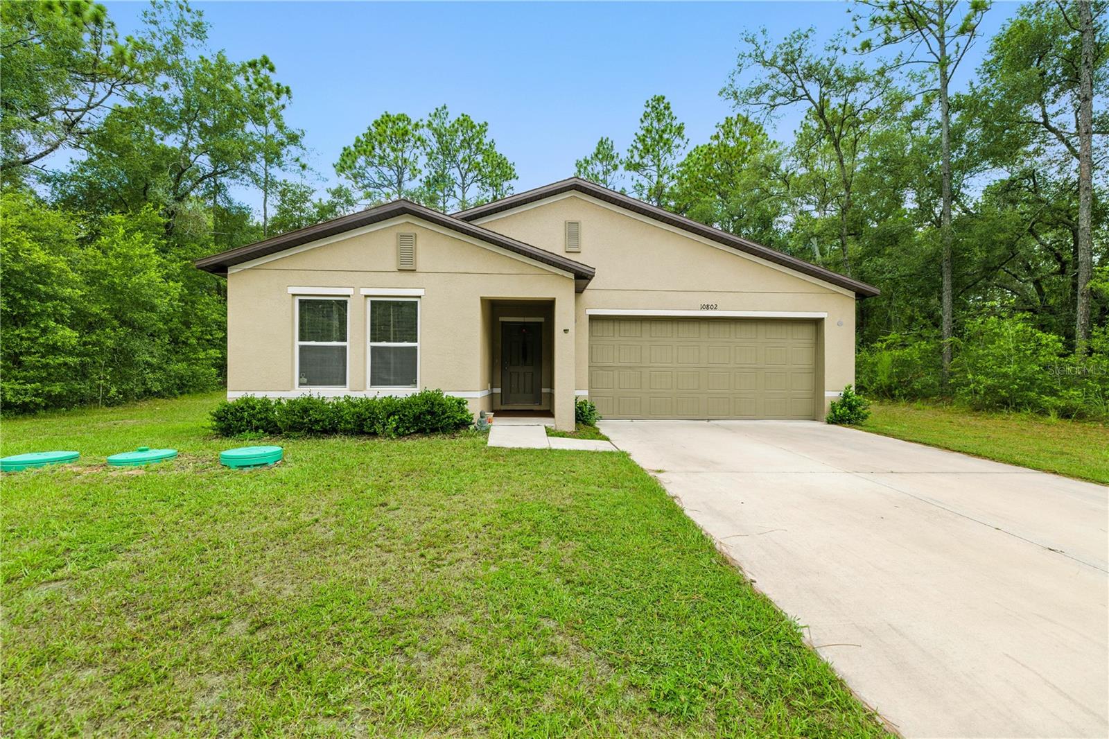 Charming 2023 built home nestled in Citrus Springs! This 3 bedroom 2 bath home is set on a .23 acre lot. LVP flooring was added to the main living areas in 2024 for a rich look. The kitchen has white shaker cabinets, large island, stainless steel appliances and plenty of counter space. The large breakfast nook is big enough for a dining table as well The OPEN CONCEPT layout is perfect for entertaining and hosting. The Owner's Suite is very spacious and the bathroom is complete with a walk-in shower, dual sinks and granite counters. The backyard has plenty of space for the doggos to run around and for those wonderful outdoor days and nights. This one is a true beauty away from the hustle and bustle yet is still close to shopping and dining. Living in the heart of Florida awaits you!