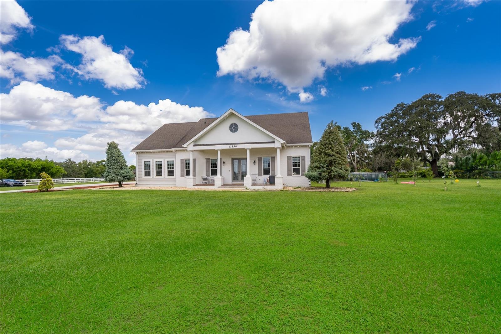 Welcome to your private paradise overlooking Lake Florence! This stunning 5-bedroom, 3 full and 2 half -bathroom home, completely renovated, offers 4,347 sqft of living space (5,283 sqft total) on an expansive 2.99-acre estate. Enjoy glistening lake access for boating, skiing, and waterfront BBQs from your own dock recently renovated and beach, with a rare legacy of ownership—only three families in over 25 years. A true retreat with no HOA, offering the freedom to expand or personalize. The property have potential for two additional buildable lots (0.55 and 0.50 acres) with a separate rear entrance, ideal for future homes or guesthouses—or imagine building a horse barn under the oak trees or even your dream pool, cabana project. Have fun on the Soccer field, 2 zip lines, big play ground, and chicken coop. Inside, the home is completely renovated with a modern, light-filled kitchen, porcelain floors, and stylish bathrooms, master suite on first floor is tucked off the back of the house and has a huge ensuite bath with oversized soaking tub and ample closets! Energy-efficient windows, a 2016 A/C system, a new other AC UNIT 2023 and updated plumbing (Dec 2020),whole house filter and Kinetico soft water system add comfort and value. Have fun at your own 500 sqft private movie theater, perfect for entertaining family and friends. Enjoy the view of pristine Lake from your kitchen while cooking your favorite dish and gathering. Fine dining space, living room with porcelain floor and soaring ceilings, French doors lead you to an enclose terrace for more fun with games, parties or family events you have always wanted to host in the best way! Brand new carport!
Unbeatable location—walking distance to world famous Montverde Academy, minutes to the Florida Turnpike, Bella Collina Spa, Montverde's quaint local eateries or go a few miles more to Historic Downtown Winter Garden's infamous Farmers Market or Clermont’s Waterfront Park! While you’re contemplating, the West Orange Trail at your doorstep. Schedule your view today ! And be ready to live the Montverde lifestyle!!
Please note that the above sale includes only Lot C, which is the front lot with the house (see attached survey). Lots A and B are not included in the sale. The Seller has already submitted plans to subdivide the property into Lots A, B, and C, and approval is should be finalized by the time of closing.