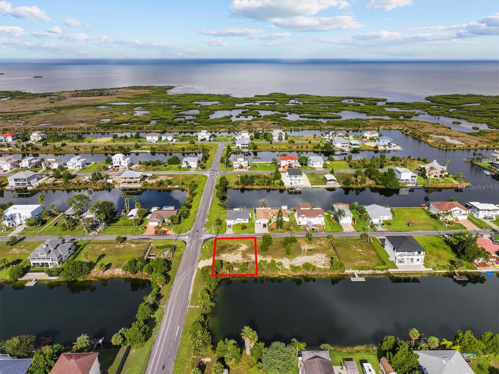 Waterfront Building Lot in Hernando Beach!
This 71 x 100 residential lot in the indirect Gulf access section of Hernando Beach is the perfect setting for your Gulf Coast fishing home! This lot has 71 feet on a spring fed freshwater canal.
Located in a no-HOA community, this lot offers flexibility and freedom—use your future home as a short-term rental for income potential or simply enjoy the perks of coastal living with no deed restrictions! Store your boat, trailer, or commercial vehicle on-site and build up to 8-foot privacy fences, following county codes instead of HOA rules.
Boating Info: Indirect Gulf Access – To reach the Gulf, boats must go over a seawall boat lift and then pass under a fixed bridge at street level. Freshwater canal system – Water levels fluctuate with seasonal rainfall, not the tides.
Discover Hernando Beach – A Hidden Gulf Coast Gem - Tucked away along the Gulf of Mexico, Hernando Beach is a tranquil coastal hamlet with a vibrant boating and fishing community. Here, you'll find waterfront tiki bars, marinas, seafood markets, and fine dining, all adding to the area's unique charm. Unlike its name suggests, Hernando Beach doesn’t have a traditional sandy shoreline, but it more than makes up for it with unparalleled water access and a laid-back coastal vibe.
For anglers, Hernando Beach is a world-class fishing destination with inshore fishing for redfish, snook, and tarpon, plus offshore opportunities for grouper and snapper. The Weeki Wachee River, just 5 minutes away, offers a refreshing escape with swimming, paddleboarding, and kayaking in crystal-clear 74-degree spring water.
Convenient Location - Despite its secluded feel, Hernando Beach is less than 10 minutes from US-19, offering easy access to shopping, dining, hospitals, and entertainment. Tampa International Airport is just an hour away, and Disney is only 90 minutes from your doorstep!
Build your dream home in Hernando Beach, where the Gulf Coast lifestyle meets the convenience of modern living. Call today to learn more!
