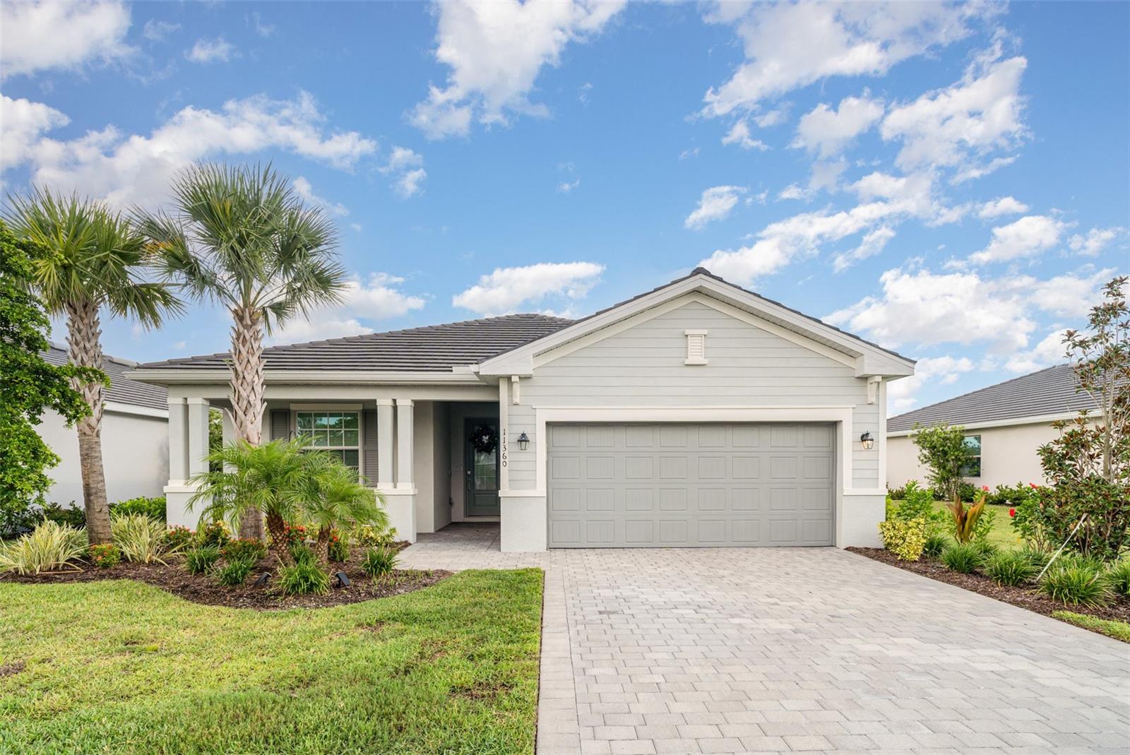 This move-in-ready "Venice" model home is located in the gated community of Antigua mat Wellen Park. The home is a beautifully
appointed 3-bedroom, 3-bath property on a lot that backs up to both a pond and a preserve, offering a mix of natural beauty and peaceful
seclusion. The open-concept design includes split bedrooms for privacy, and the spacious great room and kitchen flow seamlessly
together. The master suite has two walk-in closets and a luxurious en-suite bath with a double sink vanity. The home is equipped with
hurricane impact windows and has tile flooring throughout. Outside, a screened lanai provides an area to enjoy the views of the lake and
preserve. Residents benefit from a low HOA fee and have access to Wellen Park Village, which features the "Cool Today" Stadium, various
dining options, and community events, all within biking or golf cart distance. Downtown Venice and the Gulf beaches are also a short drive
away.