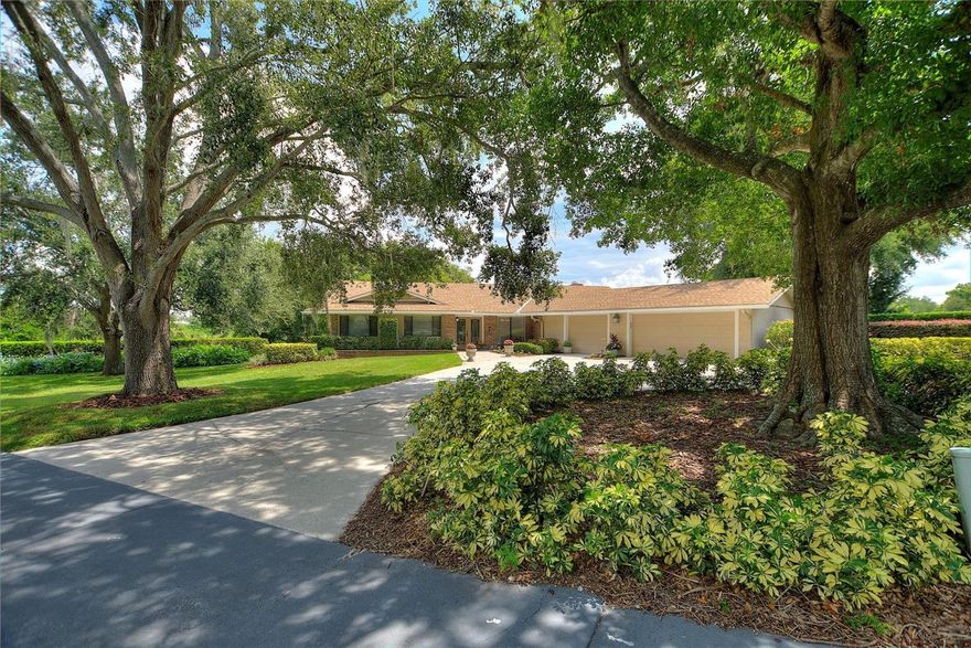 AN AMAZING 4 BEDROOM 2.5 BATHROOM HOME SITUATED ON AN OVERSIZED (.71) AC LOT ON WINTER HAVEN'S FAMOUS CHAIN OF LAKES!!!  This home on Spring Lake has amazing water views from the inside of nearly all rooms and especially from the 850 Sq Ft. covered screened patio with oversized pool.  Enjoy the shade in both the front and back yards provided by the beautiful oaks while you appreciate the lake breeze!  Some NOTABLE UPGRADES INCLUDE:  2 new AC's in 2025, new irrigation pump motor in 2024, new hot water heater in 2023, newer screen panels on cage, and completely replumbed in 2015.  The chef in the family will enjoy the great lake view from the kitchen, marble countertops, and double ovens!  Cozy up in the family room next to your very unique wood burning brick fireplace.  Don't miss out on some of the small details as well with CEDAR FLOORING in all bedroom closets. This home provides an abundance of storage, especially in the hallways and oversized laundry room with utility sink.  Never worry about parking again with the large HALF CIRCLE DRIVEWAY and 3 CAR GARAGE.  Interlachen is a very established neighborhood with custom homes and sprawling oak tree lined streets.  This lovingly maintained property is conveniently located just minutes from DOWNTOWN WINTER HAVEN which has most recently added some AWARD WINNING FINE DINING spots to it's list.  LEGOLAND, shopping, medical and entertainment is all withing close proximity of this home as well.  Don't miss out on this lakefront opportunity within the City of Winter Haven, a city that's always maintained it's small town charm!