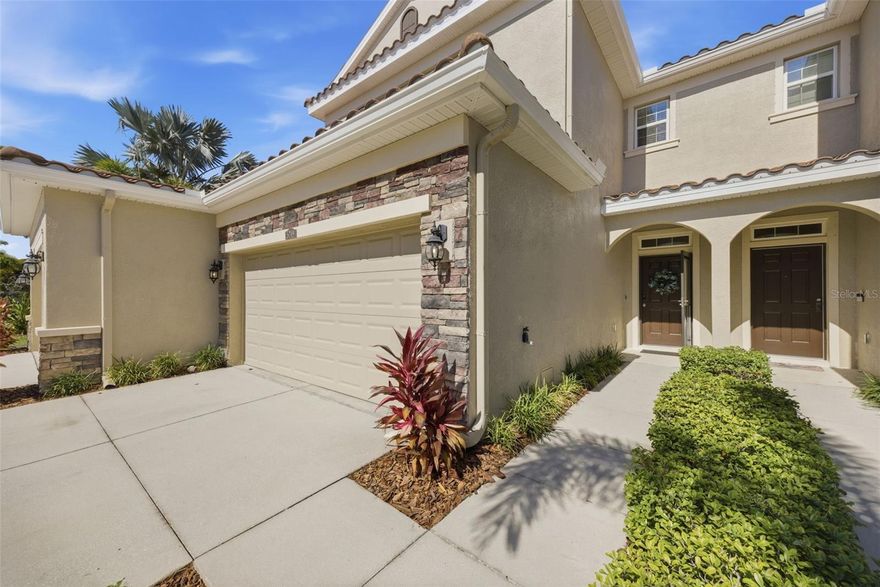Located within the gated community of Colonnade, this beautifully maintained 2016-built townhome offers the perfect blend of low-maintenance living and peaceful surroundings while remaining conveniently close to shopping, dining, and everything Tampa Bay has to offer. Situated in Flood Zone X, this move-in ready residence features upgraded flooring throughout with no carpet, hurricane shutters, and thoughtful updates that add both style and functionality.

The spacious kitchen is designed for everyday living and entertaining with granite countertops, 42-inch cabinetry, stainless steel appliances, and an oversized pantry. Large sliding glass doors open to a private patio overlooking green space, creating a quiet outdoor retreat. The primary suite showcases a tray ceiling and custom walk-in closet, while all bedrooms offer custom closet systems for exceptional storage and organization.

Additional upgrades include a newer microwave, newer HVAC compressor, newer water heater, new window screens, and an oversized two-car garage. Residents enjoy resort-style amenities including an oversized pool with lounge areas and hammocks, outdoor cabana with fire pit and grilling area, community park, and inviting outdoor entertaining spaces.

Perfectly positioned between St. Petersburg and Clearwater, and just minutes from St. Pete–Clearwater International Airport and downtown Tampa, this home offers convenience, comfort, and an ideal Florida lifestyle.
