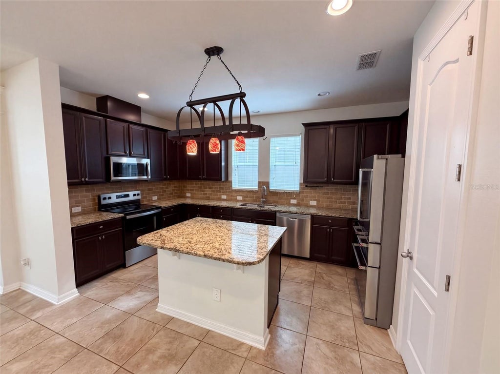 Photo of 8231 Laureate Boulevard, Orlando, FL 32827 (MLS # O6445629)