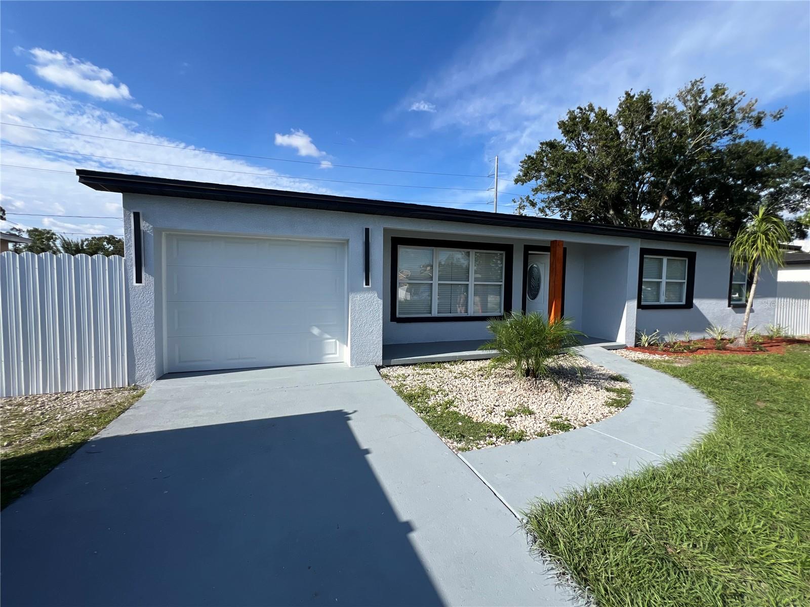 Modern Fully Renovated Home in exclusive heart of Tampa, This move-in ready residence combines elegance, functionality, and comfort in every detail. It features 5 spacious bedrooms and 3 luxury bathrooms, including a master suite with a private bath and a large walk-in closet. The living room is expansive and filled with natural light, perfect for family gatherings, while the modern kitchen comes fully equipped with brand-new stainless steel appliances. The bathrooms boast porcelain tile floors and high-end finishes, and all electrical and plumbing systems, as well water heater, are completely new. The property also offers a large laundry room with a built-in sink, a secure enclosed garage, a backyard with a detached storage house, and gated fencing that ensures privacy and security. Its modern design highlights excellent natural lighting throughout, creating a warm and elegant atmosphere. Ideally located in a central area of Tampa, close to shopping, schools, and main roads, this home represents the perfect opportunity to enjoy a brand-new, stylish, and functional lifestyle in one of the city’s most convenient neighborhoods.Schedule your private showing today.