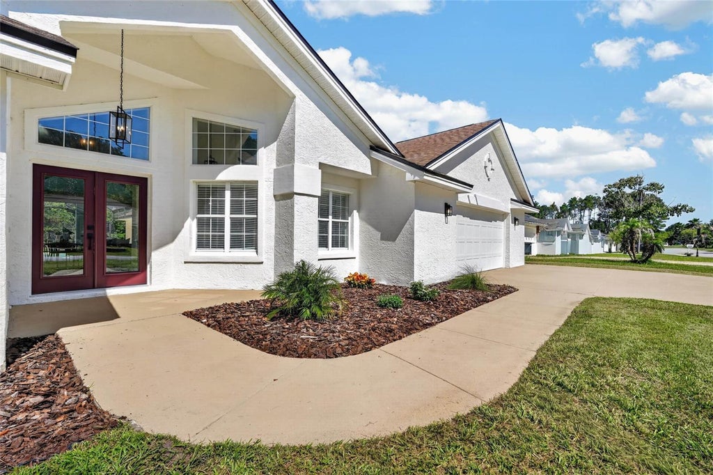 Photo of 107 Lindsay Drive, Palm Coast, FL 32137 (MLS # FC320287)