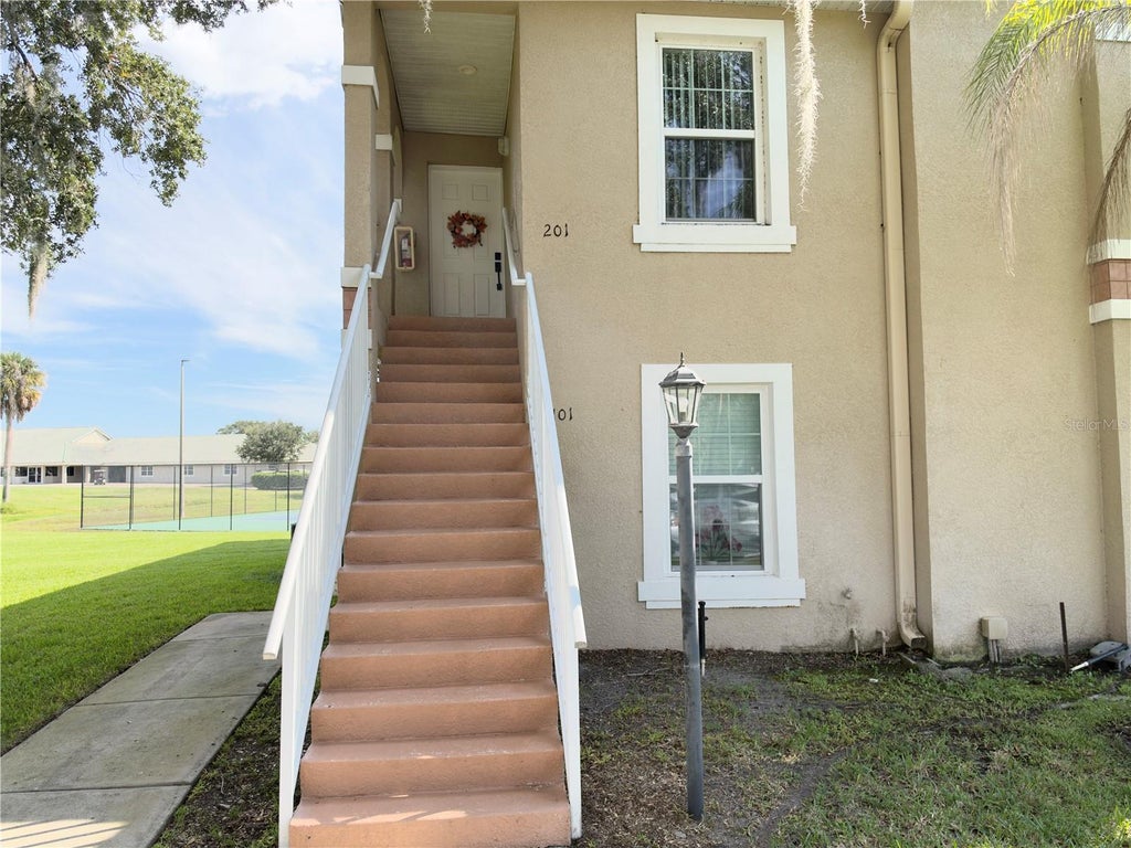 Photo of 2806 Osprey Cove Place #201, Kissimmee, FL 34746 (MLS # O6446458)