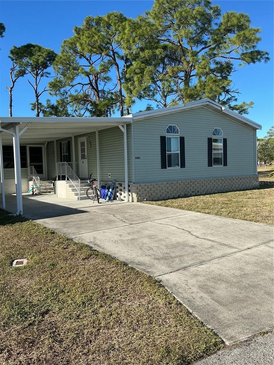 Welcome to this spacious turnkey double wide mobile home offering 1,269 square feet of comfortable living space. This open-concept floor plan is perfect for easy living and entertaining. The home features two bedrooms and two full bathrooms, along with a newer roof, air conditioning system, and carport for added peace of mind.
Enjoy the enclosed lanai, ideal for relaxing year-round, and the pleasant location situated on a cul-de-sac. Move-in ready and thoughtfully maintained, this home is a wonderful opportunity for carefree Florida living.