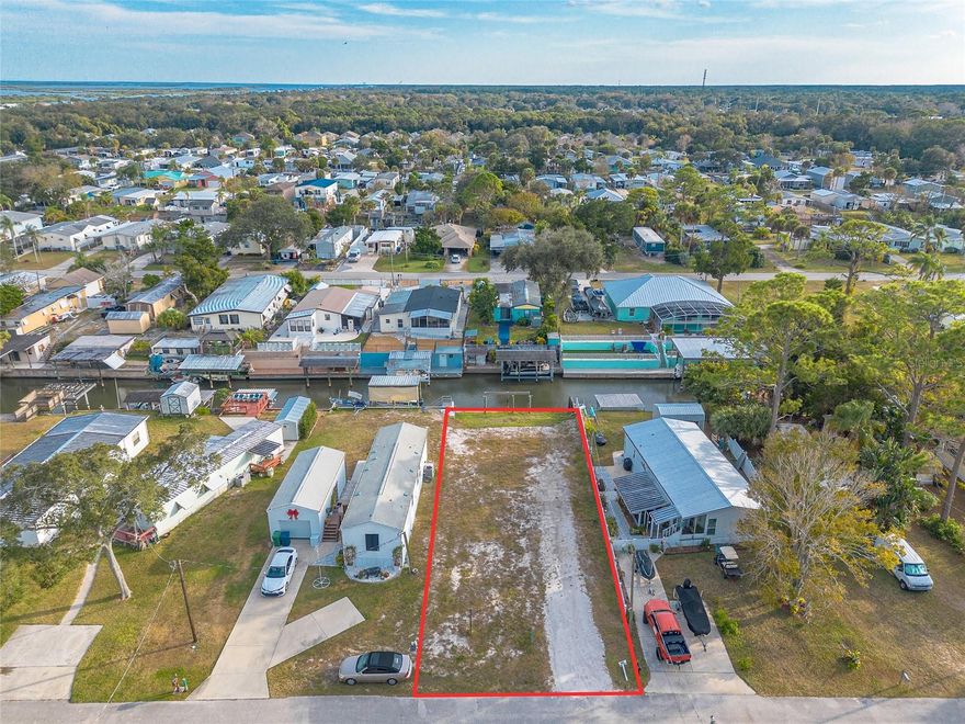 Waterfront potential, already ahead of schedule. This cleared 50 x 131 canal-front homesite in South Waterfront Park offers a rare opportunity to build along the water without starting from scratch. A newer concrete seawall is already in place, creating an ideal foundation for a custom waterfront retreat designed around boating, outdoor living, and coastal living. Positioned on a navigable canal with convenient access to the Intracoastal Waterway and the Atlantic Ocean, the property offers an exceptional setting for boating, kayaking, paddleboarding, and waterfront living. Envision a private dock, expansive outdoor entertaining areas, and a custom home designed to maximize the canal views and coastal surroundings from every angle. Located within an established waterfront area near parks, marinas, shopping, dining, and area beaches, the property combines convenience with a true coastal setting. An additional opportunity is available with a residence directly across the street also offered for purchase, creating flexible options for expanded ownership or future investment potential.

Lot measures approximately 50 x 131 feet. Buyers are responsible for verifying all property details, zoning, setbacks, and building requirements.