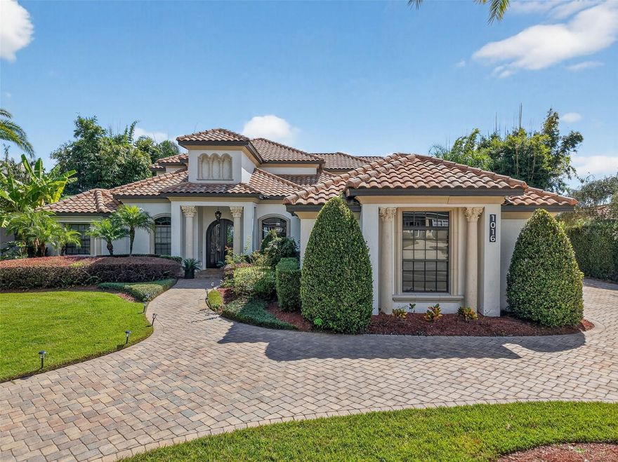 Welcome to a WORLD OF ELEVATED LIVING in this EXQUISITE MEDITERRANEAN- INSPIRED, CUSTOM BUILT LAKEFRONT ESTATE gracefully positioned within the PREMIER GATED COMMUNITY of Loch Leven, just 2.5 miles from the charm of Downtown Mount Dora. Set on 2.95 meticulously landscaped acres, this grand residence offers 5,441 square feet of refined design, comfort, and sophistication.

This thoughtfully crafted home features five bedrooms, including two private primary suites, an executive office (with plumbing for an additional bathroom), a formal living and dining room, a spacious family room that flows seamlessly into the kitchen and casual dining space, and a vibrant game room with an adjoining lounge—perfect for entertaining or relaxing with family and friends.

The luxurious primary suite on the second floor is a true retreat, featuring a private flex room that can serve as a home office or sitting area. A custom wet bar with a refrigerator makes it effortless to enjoy your morning coffee or evening drink without leaving the suite. Step outside to the beautiful private balcony overlooking the sparkling pool and tranquil lakefront — the perfect spot to unwind and take in the views. The suite also features a custom-designed walk-in closet, offering abundant storage and elegant organization. The spa-inspired ensuite boasts a relaxing jacuzzi tub, a spacious walk-in shower, and refined finishes that create a serene, resort-like atmosphere. The first-floor primary suite offers its own private entrance from the pool area and includes a beautifully appointed ensuite bathroom, making it perfect for guests or multi-generational living. Bedroom three is tucked behind a pocket door and features its own ensuite bath for additional privacy. Bedrooms four and five share a full bath and are separated by a hallway with a pocket door, creating a quiet and private guest wing.

The split layout of the home ensures maximum privacy and functionality throughout. From the moment you enter through the wrought iron and glass double doors, you're welcomed by soaring ceilings, crystal chandeliers, and a dramatic spiral staircase—bathed in natural light from expansive windows showcasing panoramic lake views. Pocket sliders open wide to a stunning outdoor living space featuring a resort-style saltwater pool, a custom outdoor kitchen, and a lanai with a second full outdoor kitchen—perfect for hosting unforgettable gatherings. A beautifully designed walkway leads you from the lanai directly to your private, extended dock with a new boat lift (2024), offering direct access to the spring-fed waters of Loch Leven Lake.

Luxury upgrades include new carpet (2025), fresh interior paint (2024), two new HVAC units with smart thermostats (2024), exterior paint refresh (2025). Additional features include a three-car garage with EV charger, tile roof, mosquito misting system, lush landscaping with mature agricultural trees, and timeless architectural details that blend elegance with comfort.

Residents of Loch Leven enjoy a vibrant yet tranquil lifestyle with amenities including tennis and pickleball courts, a playground, a community boat ramp and dock, and private on-site storage is available to rent for boats, RVs, and recreational toys.

Make this your dream home—where luxury, serenity, and elegance come together in perfect harmony in one of Mount Dora’s most sought-after communities.