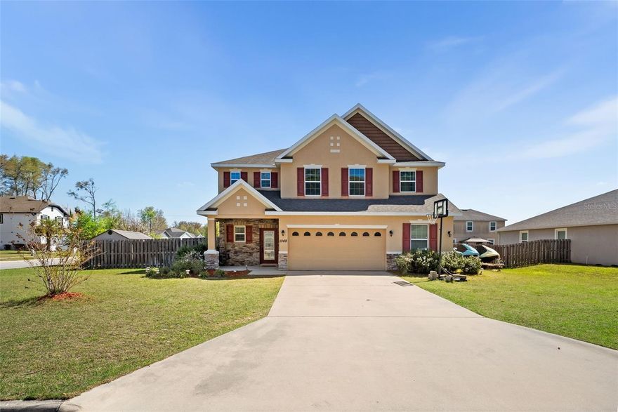 Luxury and location come together in this stunning concrete-block home on a spacious corner lot in sought-after Newberry Oaks, a desirable non-HOA neighborhood just minutes from the new Publix and exciting future developments in the growing city of Newberry. Offering approximately 3,350 square feet of heated and cooled living space, this well-designed residence features 4 bedrooms, 2.5 baths, a private office, great room, dining area, flexible game or formal dining room, and an upstairs bonus or media room, providing exceptional space for modern living. A welcoming stone-clad front porch and decorative glass entry open to a bright foyer with a convenient command station and office nook, while the open-concept living area with soaring ceilings highlights a beautifully appointed kitchen with granite countertops, a large island with breakfast bar, 42-inch espresso wood cabinetry, stainless steel appliances, and recent upgrades including a 2025 dishwasher, 2024 refrigerator, and 2020 gas range. Interior finishes include luxury vinyl plank flooring in the main living areas, tile in wet areas, and updated 2023 carpet in the bedrooms, complemented by elegant plantation shutters. Upstairs, a spacious loft/game room/media room offers additional gathering space (which potentially could be enclosed as 5th bedroom) alongside a large laundry room, while the expansive primary suite features a spa-inspired bath with a freestanding soaking tub, dual-head tiled shower with multiple rain shower heads, and oversized walk-in closet, with three additional bedrooms and a secondary bath with double vanities and ample storage completing the second level. Additional highlights include a gas tankless water heater, dual-zone HVAC, zoned irrigation system, and an oversized 588-square-foot garage. The private fenced backyard is designed for outdoor living with a covered pergola porch, patio, fire pit, and storage shed, gate for the big toys, making this exceptional home ideal for both entertaining and everyday comfort. Cameras onsite.