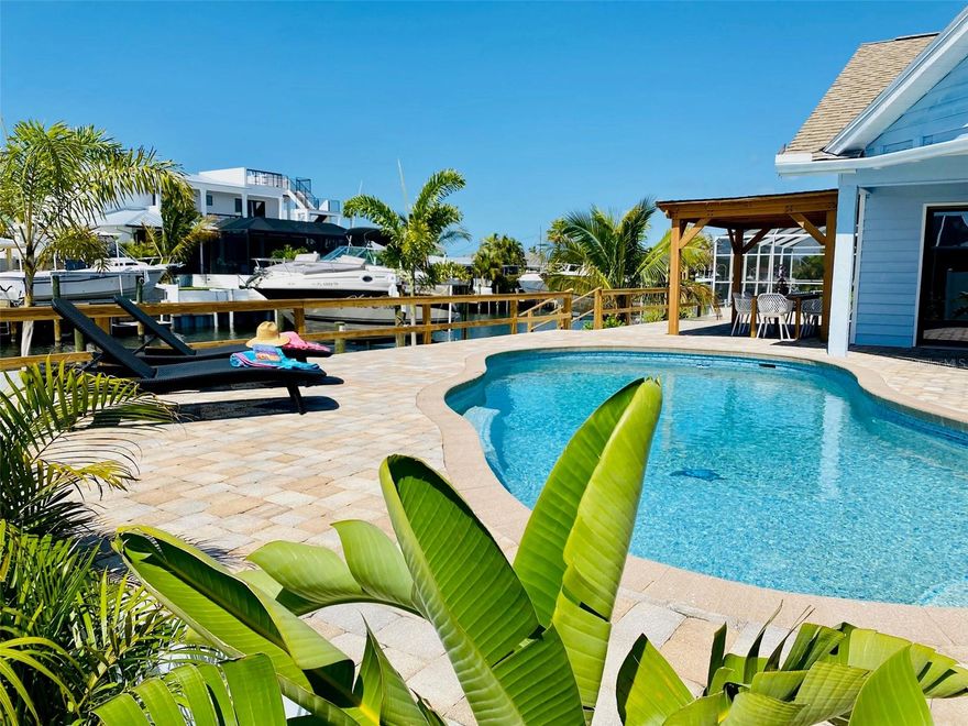 *** Waterfront *** 
Fall in love with the Gulf Coast Lifestyle.
This charming and beautifully renovated 3 Bedroom, 2.5 Bathroom canal front home, located in the boating community of San Remo Shores offers a perfect blend of indoor and outdoor coastal living. Enjoy the convenience of docking your boat right in your backyard with direct access to the inter coastal waterway and the crystal-clear waters of the Gulf (No Bridges).
It is just a short drive away from the wonderful white sandy beaches of Anna Maria Island, close to the IMG Academy, shopping and dining and the Old Florida charm of Historic Cortez Village.
This beautiful dream home is currently operating as a successful short term rental, generating strong income and earning outstanding guest reviews.

H I G H L I G H T S:
every bedroom has a sliding door and water views * 
vaulted ceilings create an open and airy feeling * 
double sided wood burning fireplace  * 
spacious and open Living-Dining-Kitchen area  * 
modern kitchen with quartz countertops, stainless steel appliances and walk-in pantry * 
split bedroom plan for exceptional privacy * 
primary suite with walk-In closet and a spa inspired ensuite bathroom with spacious double shower and free-standing tub 
pool bathroom * 
outdoor shower * 
heated pool with LED light * 
oversized garage * 
circular driveway with abundant parking     

  --  N E W -- 
Roof (2024), Seawall (2022), Dock (2022), Boat Lift (2022), Kitchen and Appliances (2022), Pool resurfaced (2022), Pool Heater (2023), Impact proof 4-panel Sliding Door (2025)
NO FLOODING DURING THE LAST HURRICANES