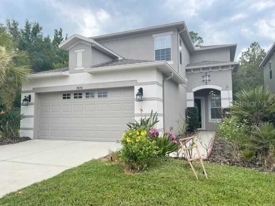 AMAZING Community of Tuscany Tampa Palms.  This 4 Bedroom home will not disappoint !!!  Very clean & Well Maintained.  4 Bedrooms, 2.5 Baths, 2 Car Garage.  Enter to view the Bamboo Flooring throughout the entire first floor.  Formal Dining and Living Rooms are perfect for your entertaining.  Other large gathering room in the back with slider doors leading out to oversized Lanai.  Lanai setting is extremely peaceful/relaxing on Conservation Lot.  Oversized side lot is great for yard fun.  Kitchen features Expresso color Cabinets, Island, Granite Countertops - enough room for all your storage needs.  Stainless Steel Appliances.  Cooktop and VERY VERY LARGE Kitchen Pantry - Another Amazing feature of this home.  Room in the Kitchen for Table w/Chairs.  Another set of Slider Doors from Kitchen leads out to Lanai.  Downstairs Laundry features overhead cabinets, Washer/Dryer, Sink - all in dedicated Laundry Room.  Primary Bedroom is nicely sized with full private Bathroom and Walk-In Closet.  2 Secondary Bedrooms are adequately sized.  4th Bedroom is HUGE !  Can also be used for another play/gathering area.  All 3 Bedrooms share a 2nd Full Bathroom.  Community is conveniently located to Restaurants, Schools, Shopping, USF, I-75 and all of the New Tampa area.  Gated Community - Call to schedule your viewing !!!