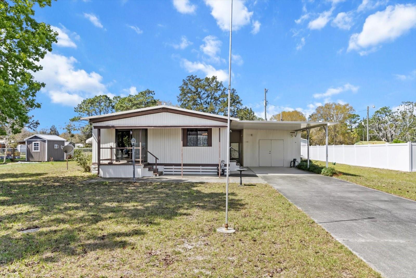 Welcome, Investors, or call it yours this, Move in Ready 2-bedroom, 2-bath home, where comfort meets practicality in an excellent location. Near Homosassa attractions, water, fishing and boating. Imagine the convenience of a sturdy metal roof overhead and a spacious workshop that wraps around to the back, giving you easy access to your backyard—great for all your outdoor projects. The inviting double front doors to the workshop create an enhanced and convenient opening to bring items in and out. The workshop has its own potty set up, adding extra convenience for you and your guests. Plus, with an attached carport, you'll have protected access to your home, making every arrival a little easier. This property is not just a house; it’s a place where you can create cherished memories. We hope you can envision yourself enjoying all it has! BRING OFFERS.