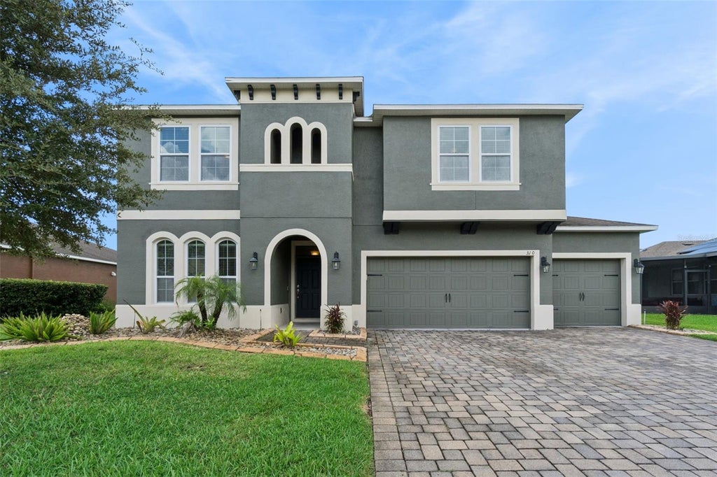 Photo of 310 Brunswick Drive, Davenport, FL 33837 (MLS # O6438364)