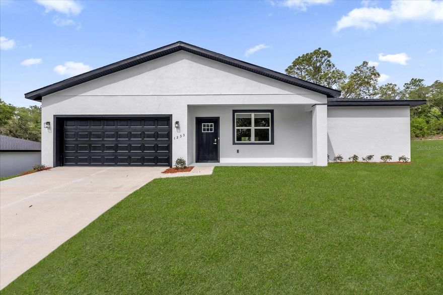 HUGE OPPORTUNITY BRAND NEW HOME IN CITRUS SPRINGS | NO HOA! This brand-new construction offers 4 bedrooms, 2 bathrooms, 1,845 sqft of modern living, sitting on a 0.31-acre lot in one of the fastest-growing areas. Featuring an open-concept layout with high ceilings and abundant natural light, this home was designed to impress. The kitchen stands out with white shaker cabinets, quartz countertops, stainless steel appliances, and a large island perfect for entertaining. The primary suite offers comfort and privacy with dual vanities, a walk-in shower, and a spacious walk-in closet. Stylish finishes throughout, including luxury vinyl flooring and contemporary fixtures. Enjoy a large backyard with extra space thanks to the 0.31-acre lot perfect for entertaining, future upgrades, or simply relaxing. Located near golf courses, parks, and just minutes from Dunnellon and Crystal River. Motivated seller, great opportunity for primary home or investment. Schedule your showing today!