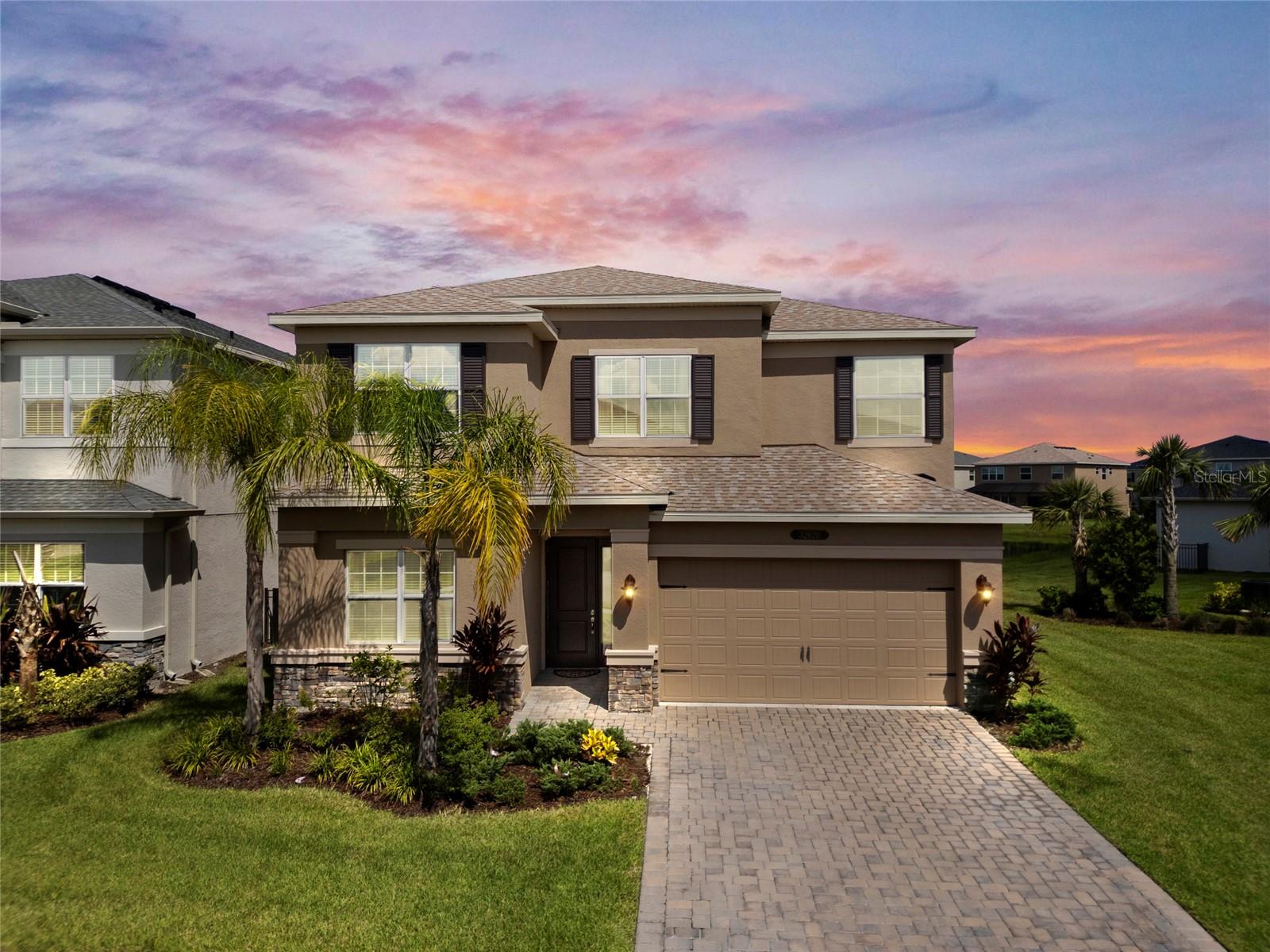 Welcome to LUXURY LIVING in your dream home in the prestigious Winding Ridge community, where resort-style amenities, elegant finishes, and functional design come together in one unforgettable package! This 4-bedroom, 4-bathroom STUNNING residence with a 2-car garage is like NEW and barely lived in! It is perfectly positioned on a premium lot with a tranquil pond view—offering the perfect balance of privacy, beauty, and convenience. From the moment you arrive, you’ll be impressed by the home’s PAVERED driveway, lush landscaping, and undeniable curb appeal. Step inside and you’re greeted by an expansive OPEN FLOOR PLAN filled with natural light, high ceilings, and thoughtful upgrades throughout. Whether you're hosting a dinner party or enjoying a quiet evening at home, this layout adapts to every occasion with ease! The heart of the home is the GORGEOUS kitchen fit for a chef, designed to inspire creativity and togetherness! Picture yourself preparing meals on gleaming WHITE MARBLE countertops, gathering around the large CENTER ISLAND, or cooking up your favorite dish on the GAS RANGE surrounded by STAINLESS STEEL appliances. With soft-closed white cabinetry and sleek GOLD handles, this kitchen looks like it came from an HGTV magazine! Don't forget the oversized pantry and under the stairs storage spaces! The home has a brand new water softener system and is plumbed and ready for a WHOLE HOUSE R.O. SYSTEM! The kitchen flows seamlessly into the dining area and living room, creating a warm and welcoming space that overlooks the peaceful pond just beyond your back windows—a daily view that soothes and inspires. Need a dedicated workspace or guest room? The BONUS ROOM (or office) on the main floor offers that valuable flexibility and could easily be transformed into a 5TH BEDROOM if desired! Upstairs, your primary suite is a true retreat. Wake up to lovely morning views, unwind in the spa-like en suite bathroom with garden tub, and enjoy the organization of DUAL WALK-IN CLOSETS! You'll also find a secondary bedroom with its own private en suite—perfect for guests or a teen suite—plus two more generously sized bedrooms and a convenient upstairs laundry room that makes daily life a breeze! This home isn't just beautiful—it's low maintenance, too! HOA fees include lawn care, landscape maintenance, fertilization, and pest control, so your weekends are free for what really matters. And life at Winding Ridge? It’s like a vacation that never ends! Residents enjoy access to resort-style amenities, including the sparkling RESORT-STYLE POOL with SPLASH PAD, the fully equipped fitness center, PICKLEBALL and Tennis courts, playground, indoor event room and the elegant clubhouse with indoor sports courts! Located in one of the most sought-after communities, this home offers the lifestyle today’s buyers crave—luxury, convenience, space, and serenity—all with NO CDD fees and NO New Construction drama! Just a stone's throw away from I75 and I275, making commuting a breeze! This beautiful home is also close to hundreds of shops and restaurants, Baycare Hospital and Advent Health, Moffitt, Wiregrass Mall, Tampa Premium Outlets and MORE!