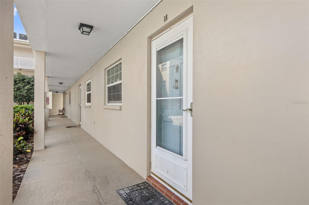 Photo of 10215 Regal Drive #18, Largo, FL 33774 (MLS # TB8550214)