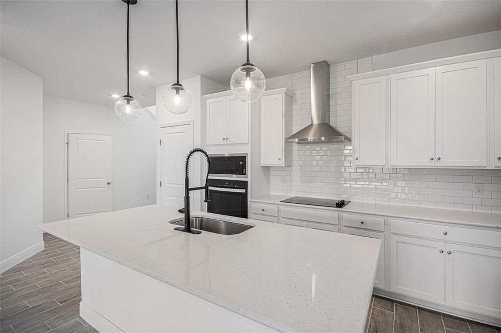 Photo of 2028 Sunshine Peak Drive, Minneola, FL 34715 (MLS # O6371770)