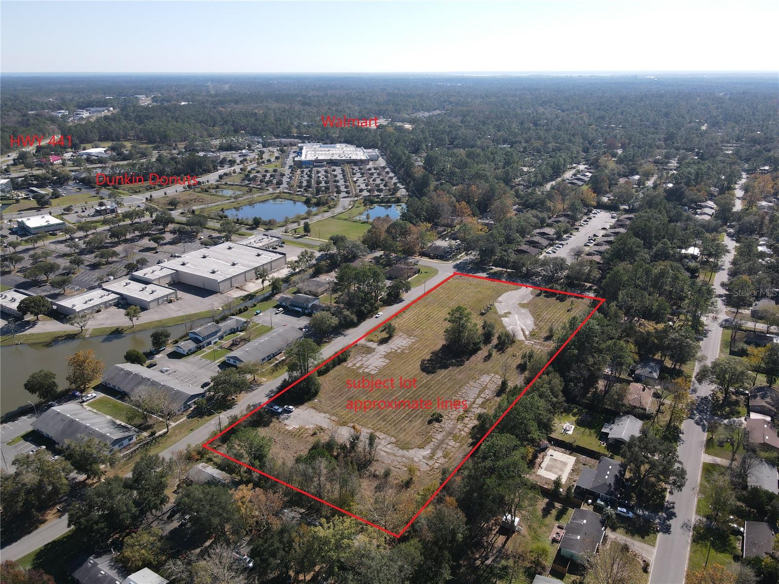 An excellent northwest location just off US 441 this 5 acre parcel is waiting for development and has incredible potential for multiple uses. High and dry, flat land - a plus for construction! RMF7 Zoning allows commercial or residential options up to 14 units per acre with duplex or quadraplex construction such as multi-family, churches, elder or childcare facilities. Located with walking distance to Walmart, and close proximity Advance Auto Parts, Dunkin Donuts, and Northwood Village Shopping Center. This is a value for the astute investor looking to maximze this large site.