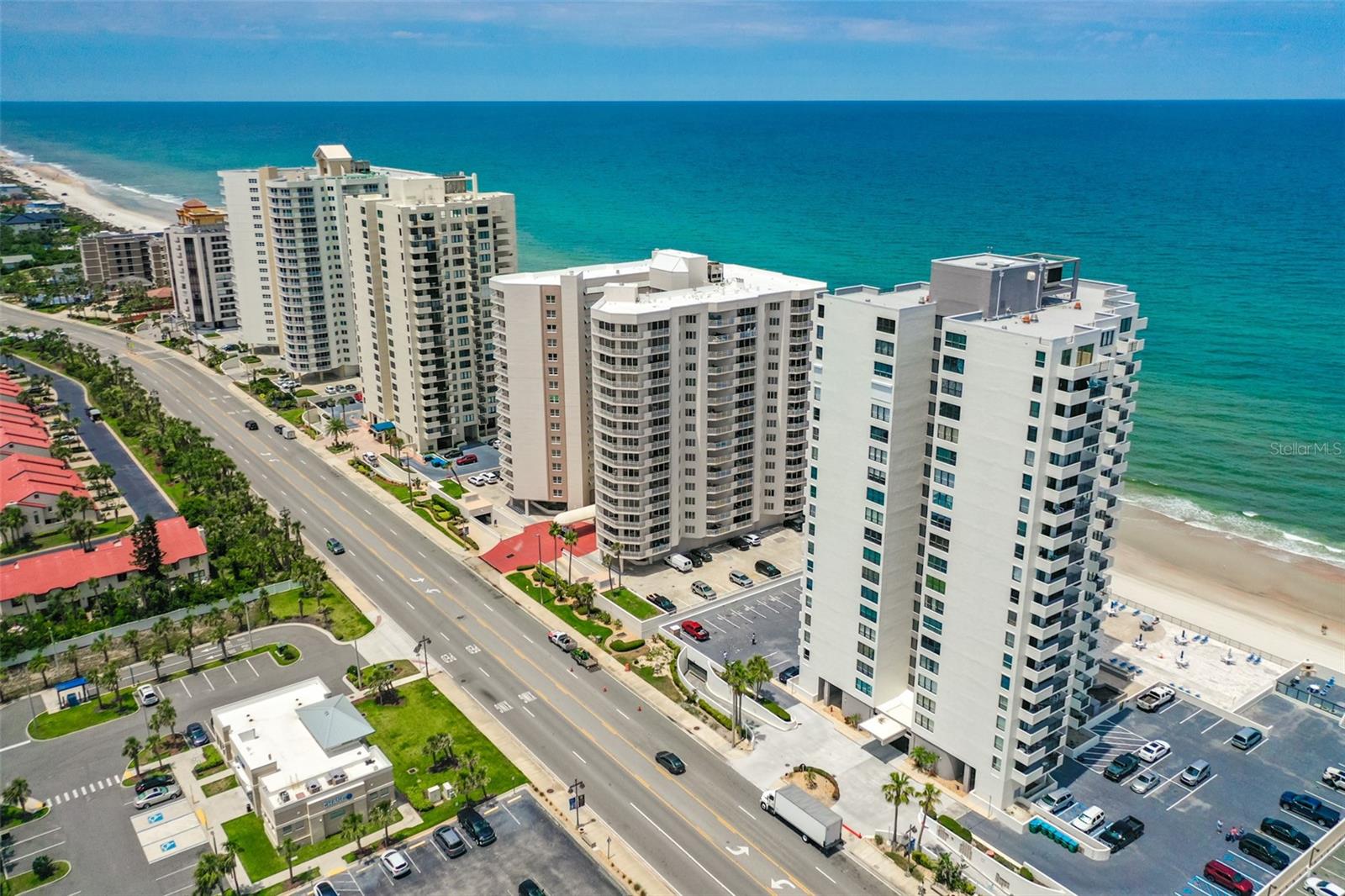 ENTER THE CONDOMINIUM AT OCEANS FIVE AND DISCOVER THE COASTAL CHARM OF LIVING AT THE BEACH ALONG THE GOLDEN SHORES.
306 IS A STUNNING CORNER UNIT FEATURING 2 BEDROOMS, 2 BATHS WITH A SPLIT FLOOR PLAN AND A SPRAWLING 1,062 SQ. FEET. ENJOY BREATHTAKING OCEAN AND RIVER VIEWS FROM THIS SPECTACULAR OASIS! UPDATED LUXURY VINYL PLANK FLOORING OFFERS A BEACH INSPIRED FEEL AND YOU WILL APPRECIATE THE *UPDATED* SLIDERS AND EAST FACING WINDOWS. WITH SLIDING GLASS DOORS IN BOTH THE LIVING ROOM AND MASTER BEDROOM, YOU'LL ENJOY UNMATCHED ACCESS TO BALCONIES FEATURING STUNNING 180-DEGREE VISTAS, RANGING FROM THE SPARKLING OCEAN TO THE PICTURESQUE SUNSETS OVER THE RIVER.
THE OPEN FLOOR PLAN IS VERSATILE AND THIS FLORIDA DREAM HOME OFFERS A LAID-BACK LIFESTYLE THAT YOU'VE ALWAYS WANTED!
OCEANS FIVE OFFERS 113 UNITS ON 21 FLOORS WITH 6 CONDOS PER FLOOR. LAUNDRY *can* BE INSTALLED IN YOUR UNIT WITH A PERMIT OR USE THE COMMERCIAL GRADE LG WASHER/DRYER (free) WITH DOWNLOADABLE APP AVAILABLE ON EACH FLOOR.
THIS PET-FRIENDLY COMMUNITY WELCOMES TWO DOMESTIC PETS, WITH A COMBINED WEIGHT LIMIT OF UP TO 20 POUNDS. ADDITIONAL AMENITIES INCLUDE UNDERGROUND PARKING, EXTRA ABOVE-GROUND PARKING SPACES, A CAR WASH AREA, PERSONAL STORAGE CAGES, AND A DEDICATED BIKE STORAGE AREA.
AMENITIES INCLUDE A HEATED OUTDOOR POOL WITH LARGE SUNDECK, BBQ STATION, SOCIAL ROOM, FITNESS CENTER, LIBRARY AND *direct beach access*. This home is in a sought-after location close to Publix, restaurants, shopping, minutes to Ponce Inlet Historic Lighthouse, just over an hour to Disney/Orlando and three-and-a-half hours to Miami. All information intended to be accurate but is not guaranteed.