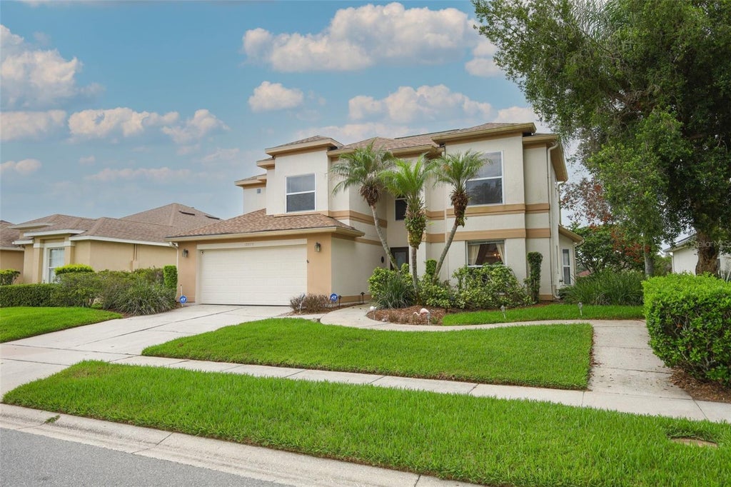 Photo of 12879 Waterhaven Circle, Orlando, FL 32828 (MLS # O6431145)