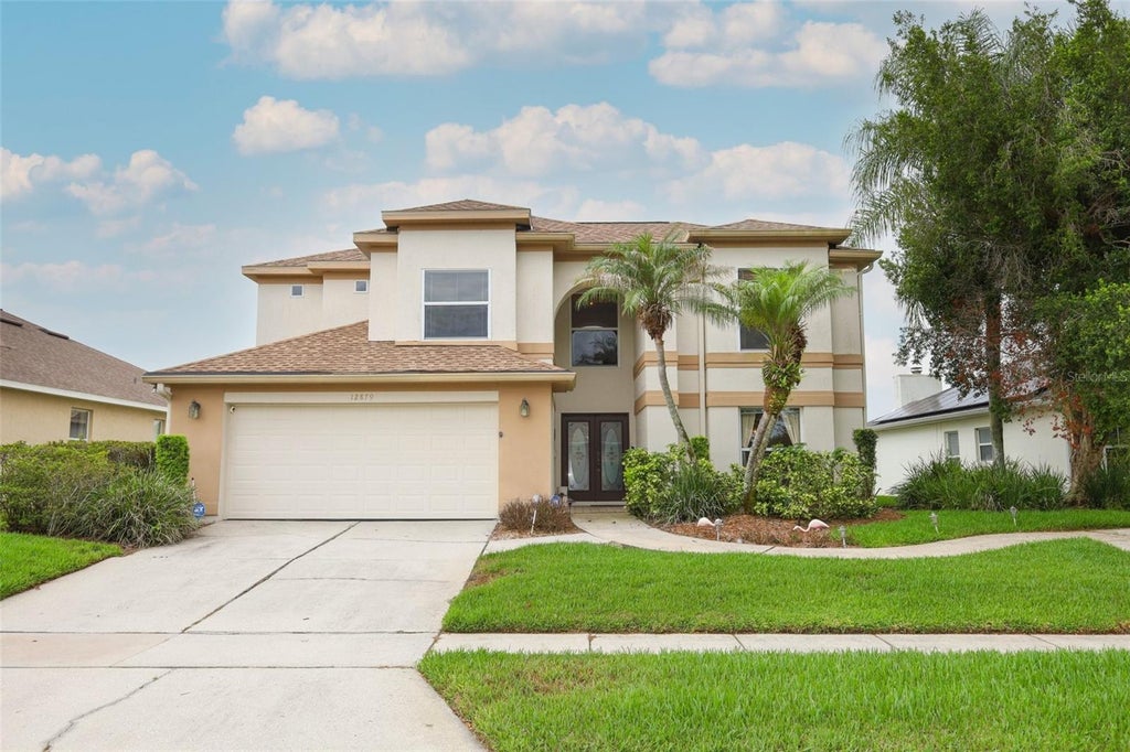 Photo of 12879 Waterhaven Circle, Orlando, FL 32828 (MLS # O6431145)