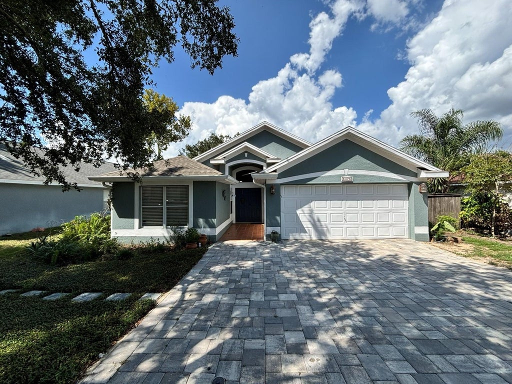Photo of 6473 Long Breeze Road, Orlando, FL 32810 (MLS # O6433378)