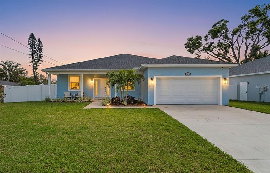 Newer construction (2023 build) with thoughtful design, modern finishes, and no flood zone worries. This 1,843 sq ft block home by Dearden Homes offers 3 bedrooms, 2 full baths, a dedicated office, and an oversized two-car garage, and is one of two newly built homes positioned side by side. Inside, 9'4" ceilings and abundant natural light immediately set the tone, creating an open, airy feel throughout the home. The main living space flows seamlessly from kitchen to dining to living room, making it ideal for both everyday living and entertaining. The kitchen was designed with both beauty and functionality in mind, featuring quartz countertops, premium stainless-steel appliances, 42-inch wood cabinetry with soft-close drawers, a spacious pantry, and a large island perfect for gathering with friends or casual meals. Designer touches like gold hardware and accents add a refined, modern feel. The primary suite is a true retreat with two walk-in closets and French doors leading out to the covered lanai, creating a seamless indoor-outdoor connection. The spa-inspired primary bath features quartz countertops, dual sinks, a soaking tub, and a spacious walk-in shower with bench. Additional highlights include a dedicated laundry room with cabinetry and utility sink, luxury waterproof vinyl flooring, hurricane-impact windows and doors, and smart home features including a Ring Pro doorbell, Nest thermostat, smart switches, and smart lock. Step outside to a fully fenced backyard oasis, offering privacy and plenty of space to entertain, relax, or create your own outdoor retreat. Even better—no HOA or CDD fees, plus a builder warranty for added peace of mind. Located within easy reach of Downtown St. Petersburg, this home offers quick access to award-winning Gulf beaches, waterfront parks, museums, dining, universities, and major airports—putting the very best of the Tampa Bay lifestyle within reach.