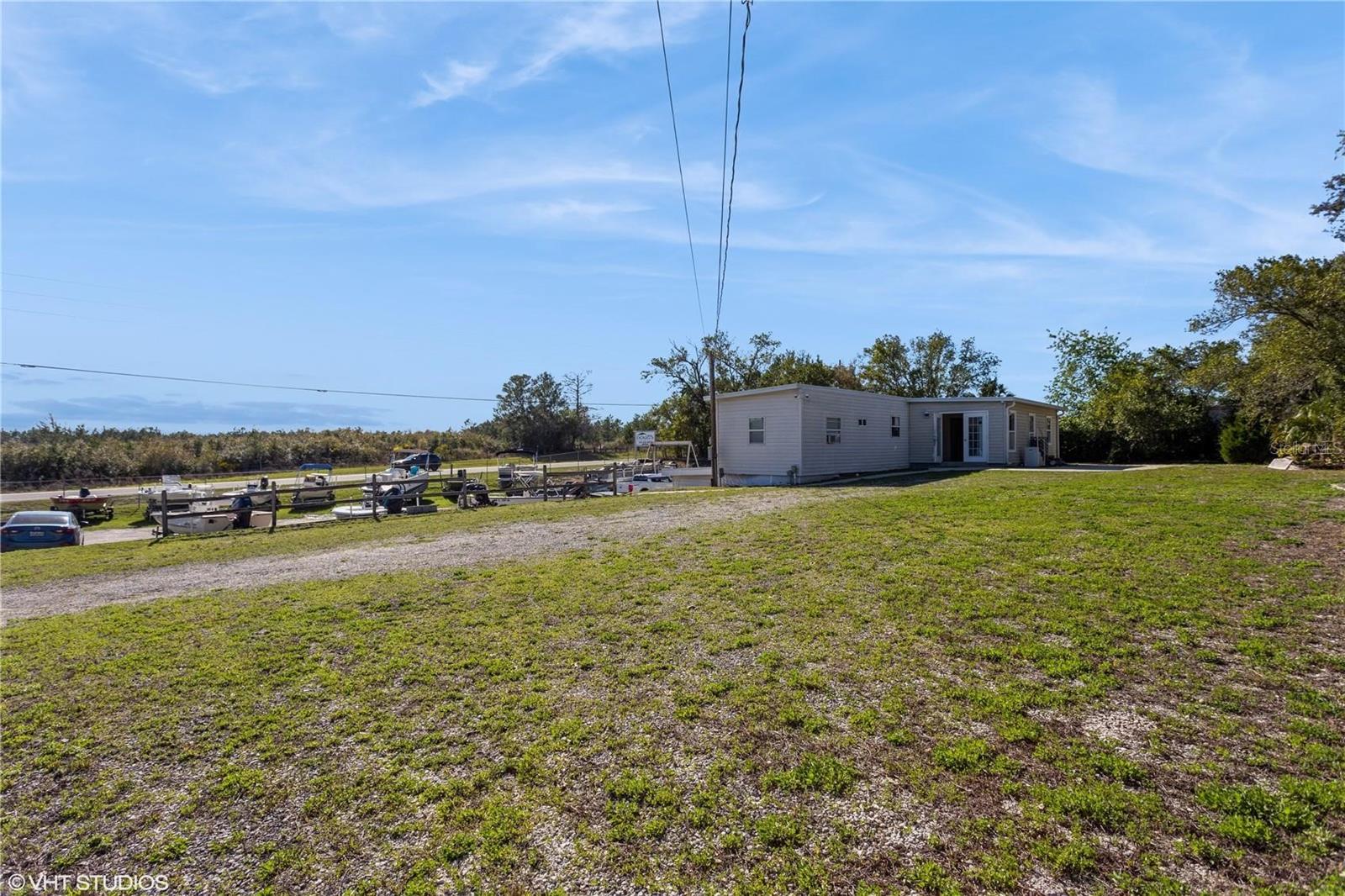 Location, Location... and Potential! Welcome to this versatile gem located on the corner of Cortez Blvd and Schering Street, in the desirable Weeki Wachee Hills Community — where commercial meets residential opportunity! Zoned C-2 (Commercial & Residential) with NO HOA or CDD fees, this fully fenced 0.52-acre property has been the home of Doug’s Marine Services Inc. for over 45 years. Offering approximately 1,736 sq ft, the upper level features a 3-bedroom, 1.5-bath residence with an open-concept kitchen and living area — perfect for owner-occupants or additional rental income. Whether you're dreaming of living where you work or starting a new business venture, this location offers endless possibilities. Situated just minutes from Weeki Wachee Springs State Park, Buccaneer Bay, Pine Island Beach, and Bayport Pier — you're in the heart of Hernando County’s natural playground. Bonus Perk! As a Weeki Wachee Hills property owner, you're eligible to purchase a private access key to a 5.6-mile stretch of the spring-fed Weeki Wachee River, part of the Springs Protection Zone and Weeki Wachee Preserve, just across the street! The private park includes a pavilion, BBQ grills, picnic tables, and peaceful river access not available to the public. Close to shopping, restaurants, medical facilities, and churches — all while still enjoying nature and serenity. Cash sale preferred, but the Seller is open to financing with a large down payment. This rare live/work opportunity won’t last long. Schedule your private showing today before it's gone!
