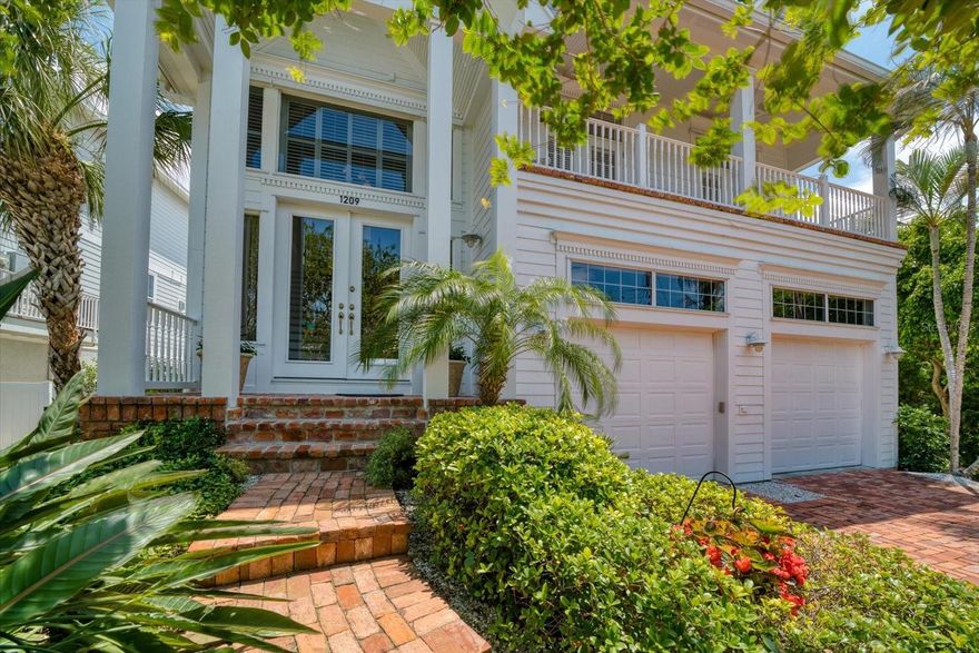 Spectacular coastal residence, offering ALL the advantages of waterfront living! Protected cove with wide open views to the intracoastal, short 5 minute walk to the BEST Gulf beaches with sunsets that are legendary, this property offers extensive space for families and guests with varied interests. The property is also suitable for the savvy investor who wants the ultimate in short term rental income. A well designed floorplan can live as two separate living areas; perfect for the homeowner who needs spaciousness and privacy for extended family, visitors, or children. Appreciate two fully equipped kitchens with breakfast bars that open to the inviting family rooms with long views over the gorgeous heated pool/spa, terraced deck area, custom dock with TWO lifts (one 10,000 lb. boat lift and a 1,500 lb jet ski lift). Bilevel living areas (approximately 1800 square foot on main level and 1965 square foot on upper level) offer abundant space to SPREAD OUT. Built to the highest standards with impressive millwork-thick crown molding, chair railing, and coffered ceilings, the quality details of this lovely property are numerous.  An impressive, staircase enhances the entry level foyer with 25 ft ceilings, clear transoms and lots of natural light. The main level has a private office/den, additional guest suite with full bath, laundry room, and spacious waterside primary suite with walk in closet, gorgeous bath area with large walk in shower, jetted tub and dual vanities. The upstairs floorplan offering a similar design as the entry level area flows seamlessly and is subtly defined by  French doors-perfect for additional privacy. Appreciate the multiple balconies for relaxing and enjoying stunning vistas from living and bedroom areas. Extremely well maintained property and flood insurance is only $870 a year! Swim in the gorgeous pool, relax in the heated spa, jump in your boat moored at your back door and cruise the intracoastal to the Gulf of Mexico just minutes away. Love the proximity to the beach, enjoy the numerous  parks, fine restaurants, recreational venues and city art center. Life could not be better than living in this outstanding property in this very popular seaside town where every day feels like a holiday! Let your imagination consider all of the possibilities this amazing property has to offer!