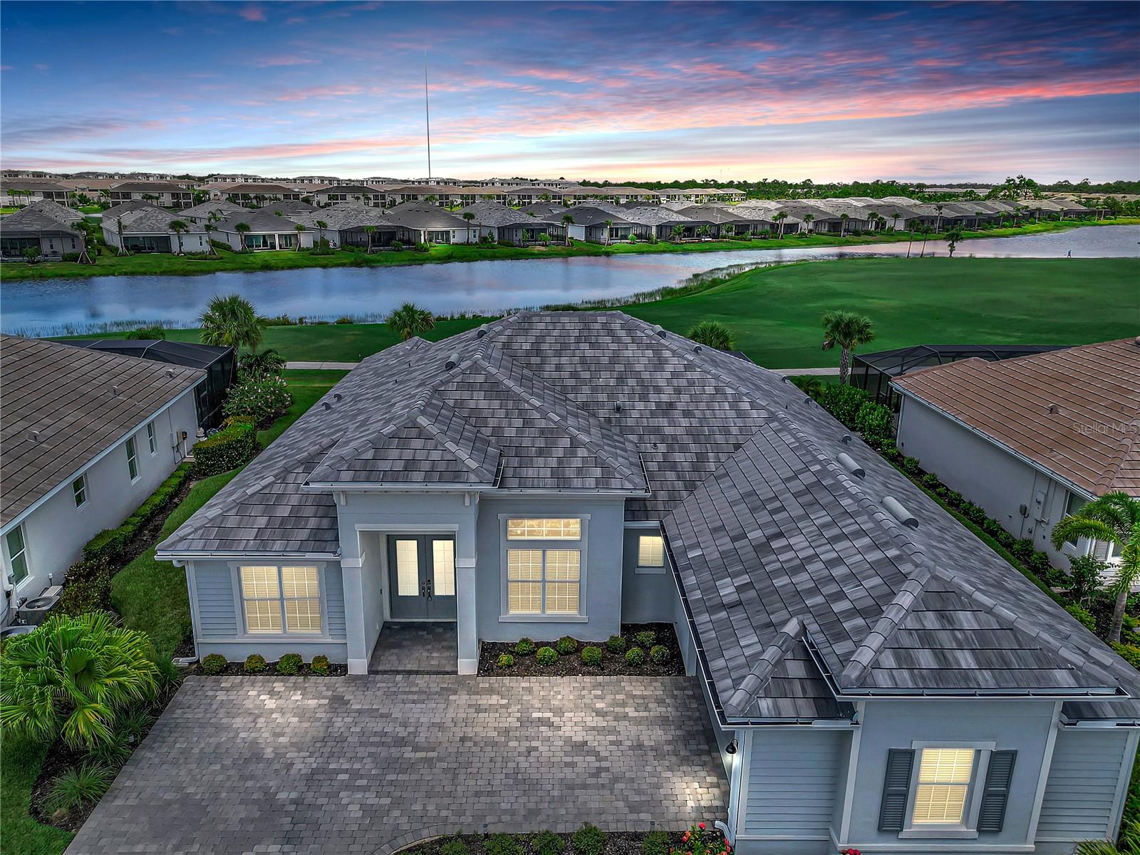 Beautiful Custom Golf & Lake View Pool Home with Luxury Features in Babcock National! Experience the perfect blend of elegance, comfort, and privacy in this stunning custom-built home, ideally situated to capture breathtaking golf course and lake views—without the worry of golf balls! With the tee box positioned back and to the left, you’ll enjoy serene vistas and minimal foot traffic.
Inside, the spacious living room features a built-in entertainment center with a TV, cozy fireplace, and coffee table, creating the perfect gathering space. The front door showcases decorative glass with built-in blinds, and crown molding enhances every room.
The luxurious master suite includes the bedroom furniture, a gorgeous vanity, a spa-like bathroom with a double-headed walk-in shower, soaking tub, and two walk-in closets. All draperies throughout the home are included.
Enjoy your own private oasis with this stunning heated pool and Jacuzzi spa, featuring a tranquil waterfall for the ultimate in relaxation. The expansive sun deck offers plenty of space for lounging, entertaining, or simply soaking up the Florida sunshine. Take in the beautiful, open views while you swim, unwind in the spa, and enjoy the electric privacy screen on both sides of the pool area where you can relax and enjoy an evening under the stars in this perfect outdoor private retreat. The gourmet outdoor kitchen is crafted with granite and stone, complete with a refrigerator & gas grill, perfect for entertaining by the screened-in pool. There is also 20K hurricane-rated electric screens protect your porch and furniture from wind and rain.
Guests will appreciate two private en suite bedrooms—one off the pool area with a walk-in shower, and another with a full bathroom and walk-in shower.
Babcock National offers an unparalleled lifestyle centered around its stunning 18-hole championship golf course.Residents enjoy a vibrant social scene with a tropical Tiki bar, sparkling resort pool, and a variety of recreational options including tennis courts, pickleball courts, and bocce ball. Stay active with group fitness classes and a state-of-the-art gym, then unwind with a rejuvenating treatment at the full-service spa. For elegant evenings, savor gourmet meals in the formal dining room. This private, gated community blends relaxation, recreation, and refined living in the heart of Babcock Ranch.
Every detail of this home has been thoughtfully designed for beauty, comfort, and peace of mind.
Enjoy living in Babcock Ranch, America's first entirely solar-powered town, with access to multiple community pools, nature trails, with shopping and dining. Come enjoy the convenience living with festivals, farmer's markets, Concerts, Health gym and just a golf cart ride to the grocery store. There is so much to do with hundreds of clubs and activities planned every month. There is a K-12 neighborhood school with a brand new sports complex, including football, soccer and baseball fields. There are many playgrounds and parks, including multiple dog parks and a brand new skate park and six new parks along the nature trails. Babcock Ranch is a top master planned community and was featured on CNN and 60 Min for not losing any power or internet after hurricane Ian made a direct hit and Milton came very close. Beautiful parks and amenities let you experience SW Florida at its finest! Come live a better life at Babcock Ranch!
