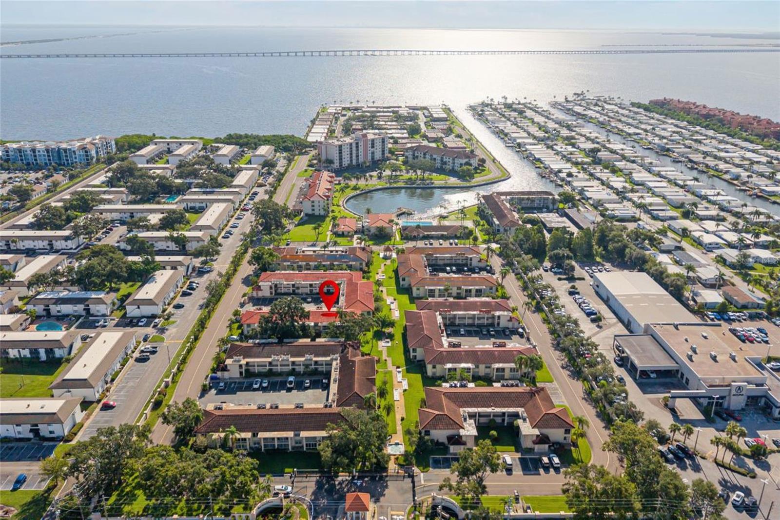 Do not miss this incredible opportunity and corner unit! Waterfront style living in a NON-flood zone including high quality flooring, modern kitchen with granite, both bathrooms updated, bi-parting sliding glass doors, new plumbing in 2023 and more. This 1st floor corner unit had spacious master bath and 2 closets (1 of which is a walk-in) 2nd bedroom has walk-in closet as well. This is an awesome 55+ gated waterfront community. Imperial Cove is located off of Old Tampa Bay and is an Active 55+ Community with amenities including a Lighted 1.5 mile Walkway with two Docks for Fishing, a Sparkling Heated Pool, Sauna, Fitness Room, Clubhouse, Library, Shuffleboard and planned entertainment. Close to everything: Trader Joes, churches, airport, beaches, restaurants, and more. HOA fees that include water, sewer, trash, cable TV and Internet with one assigned parking spot and plenty of guest parking. Very rare to find an updated condo like this with so much value.