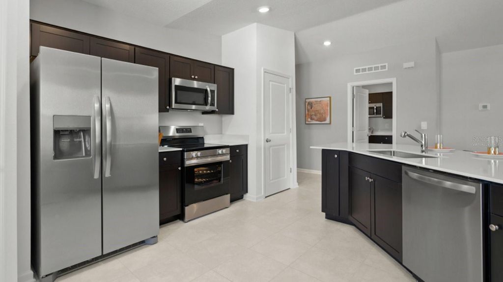 Photo of 303 Puma Loop, Groveland, FL 34736 (MLS # O6349444)