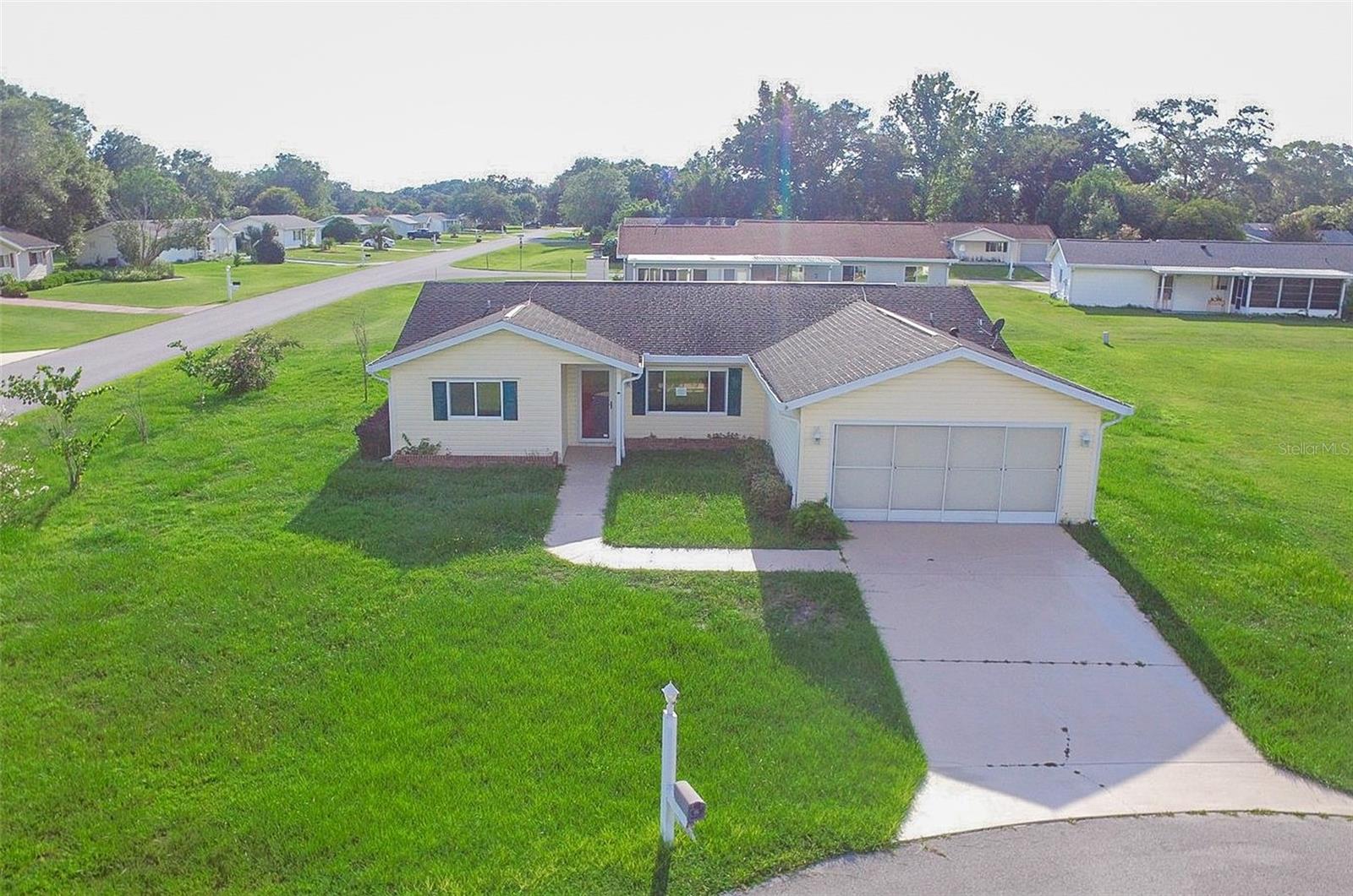 One or more photo(s) has been virtually staged. Welcome to easy living in the beautiful 55+ Spruce Creek community! This spacious 3-bedroom, 2-bath home sits on a prime corner lot and features a desirable split floor plan, a large Florida room for year-round enjoyment, and a covered rear porch—perfect for your morning coffee or evening relaxation. You'll love the convenience of the attached 2-car garage and additional storage room for all your hobbies and essentials. Spruce Creek offers residents a vibrant lifestyle with endless activities and clubs. Enjoy the lovely clubhouse complete with a workout room, sparkling swimming pool, shuffleboard, gazebo, library, and card/game spaces. The reasonable monthly fee covers trash pickup, access to the pool, clubhouse, and fitness center. Ideally located close to everything Ocala has to offer—shopping, dining, and entertainment are right at your fingertips! Don’t miss your chance to join this friendly, active community and experience the best of Florida living! Schedule your private tour today!