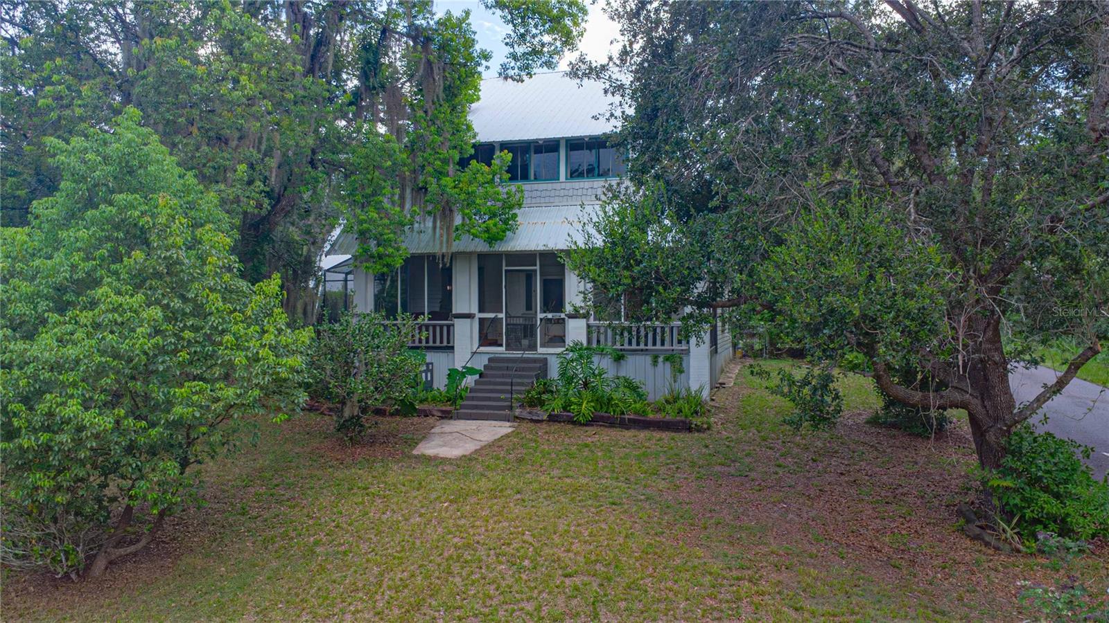 Looking for a home with character and comfort? This one-of-a-kind 3-bedroom, 2-bathroom home in historic Lake Helen offers the perfect blend of Old Florida charm and modern updates, all set on a spacious double lot with a screened-in pool.
Built 100 years ago, this 3-story home has been lovingly updated while keeping its original hardwood floors and classic feel. The finished third floor adds extra flexibility with two bonus rooms and a closet - perfect for a 4th bedroom setup, home office, playroom, or creative space.
The kitchen is equipped with new appliances and a custom farmhouse sink, and both bathrooms have been refreshed with new toilets and sinks. Major updates include a new AC system (including new eco efficient window units on the second and third floors), fresh interior paint, and a full electrical upgrade on all levels, including a new panel on the third floor, so everything is fully up to code.
Enjoy peaceful mornings or relaxed evenings on your large screened porch, or cool off in the screened pool right out back. The fenced yard, detached 2-car garage and workshop, and central vacuum system add even more value and functionality.
This home also offers two access points from different streets, making daily life easy and convenient. Whether you're looking for a family home with space to grow or a unique property with room to make it your own, this Lake Helen gem is ready for its next chapter.
Don’t miss the chance to own a true piece of local history, updated for today’s lifestyle. Schedule your tour today!
