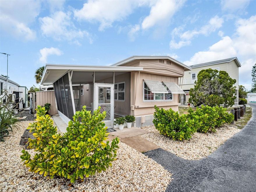 Welcome to easy Florida living in the desirable waterfront 55+ community of Chesapeake Point! This charming 2-bedroom, 1-bath mobile home offers an open and bright floor plan with a spacious living room and kitchen designed for comfortable everyday living and entertaining. Enjoy a slight water view right from the living room, bringing a touch of coastal serenity indoors.

Recent updates provide peace of mind and value, including two brand new mini-split AC units (2025), new refrigerator, new range (2024), new plywood floors, and a freshly painted exterior. Step outside to relax in the screened lanai—perfect for enjoying the Florida breeze year-round. A storage shed adds extra convenience for tools, bikes, or beach gear.

For boating enthusiasts, boat slips are available for $8,000 with a 30-year lease, offering Gulf access and endless opportunities for fishing, island hopping, and waterfront adventures. Shared seawall. Best of all, the co-op fee is included in the sale price.

Located in vibrant Tarpon Springs, you’ll be close to charming restaurants, unique shops, festivals, beaches, water sports, rich heritage, and the famous Pinellas Trail with miles of paved trails for walking, biking, and exploring. Don’t miss this affordable opportunity to enjoy the Florida waterfront lifestyle!
