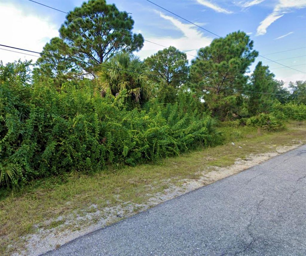 Photo of 54 Denis Avenue S, Lehigh Acres, FL 33976 (MLS # TB8490969)