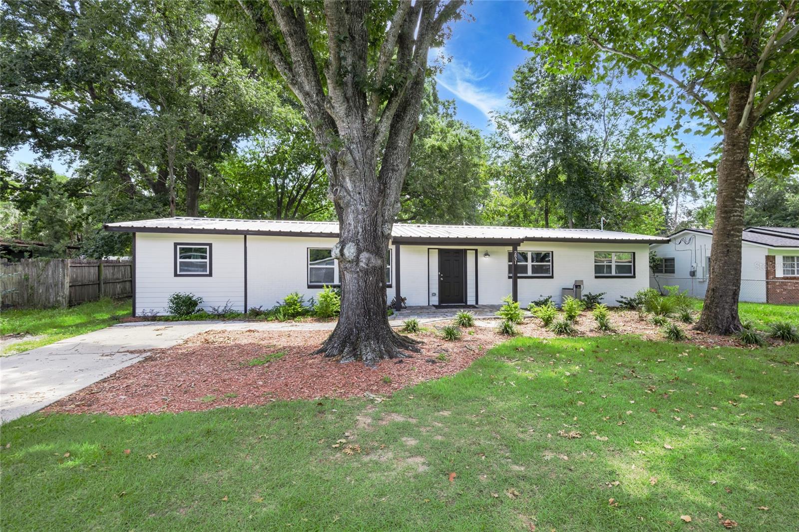 Welcome to your New Home! This home has recently been fully remodeled from the top down and everything in between! New roof, HVAC, water heater, energy efficient windows, and more!! With 4 bedrooms / 2 bathrooms, this home has space for the whole family! The flex/bonus room also has its own access. The open concept kitchen offers granite countertops with plenty of prep space and a built in air fryer in the new oven. This home also offers a full home water purification system that was just recently added for even softer and better tasting water. Enjoy the evenings out on the newly pavered patio with your very own built in fire pit overlooking the oversized fenced in backyard. Conveniently located to downtown, UF, I-75, and Gainesville regional airport, everything is right at your fingertips. Call Today to schedule your private tour!