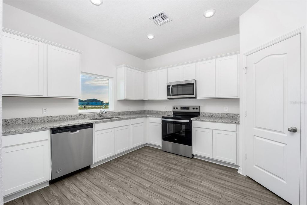 Photo of 3707 Bergamot Street, Lake Alfred, FL 33850 (MLS # TB8442853)