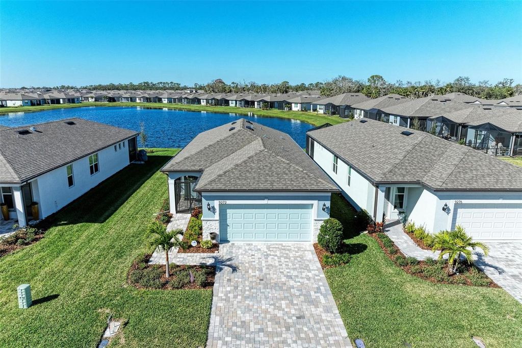 Photo of 9272 Ballaster Pointe Loop, Parrish, FL 34219 (MLS # O6355668)