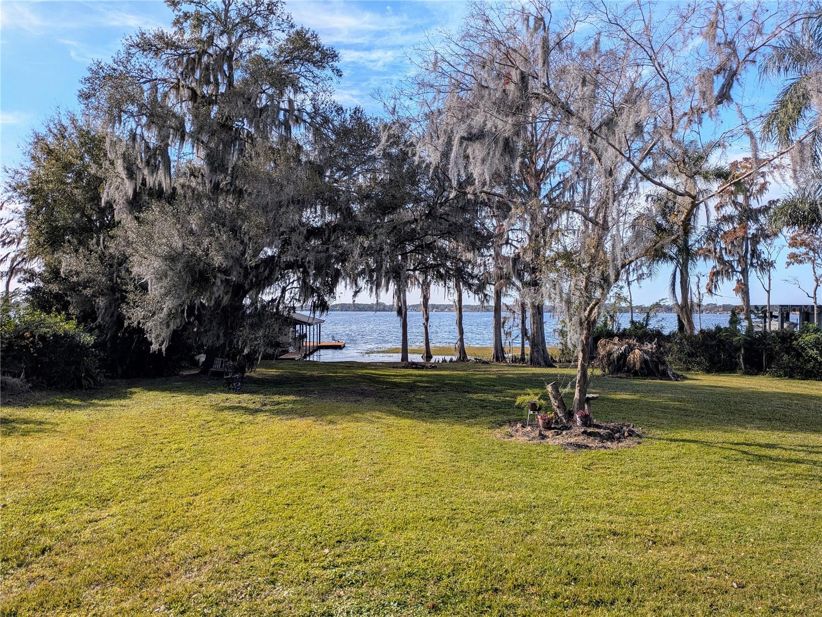 Don't miss out on this rare opportunity to live on the Butler Chain of Lakes. This property offers 100 feet of lake frontage on Lake Sheen. Property records show 4.56 acres, about 1.7 acres of that land is dry. If the current home is not what you are looking for BRING YOUR BUILDER AND CREATE YOUR DREAM HOME!! The views are amazing and if the beautiful sunsets are not enough to take your breath away wait until later in the evening when you get a front row seat to Disney fireworks! Enjoy your weekends fishing or skiing on the lakes, relaxing at your dock or going out for a boat ride on the Butler Chain of Lakes that has a total of 13 interconnected lakes. If you are worried about an HOA, don't there is no HOA. The location can't be beat, 5 minutes to restaurant row on Sand Lake Rd and 20 minutes to theme parks. Properties like this don't come around often.
